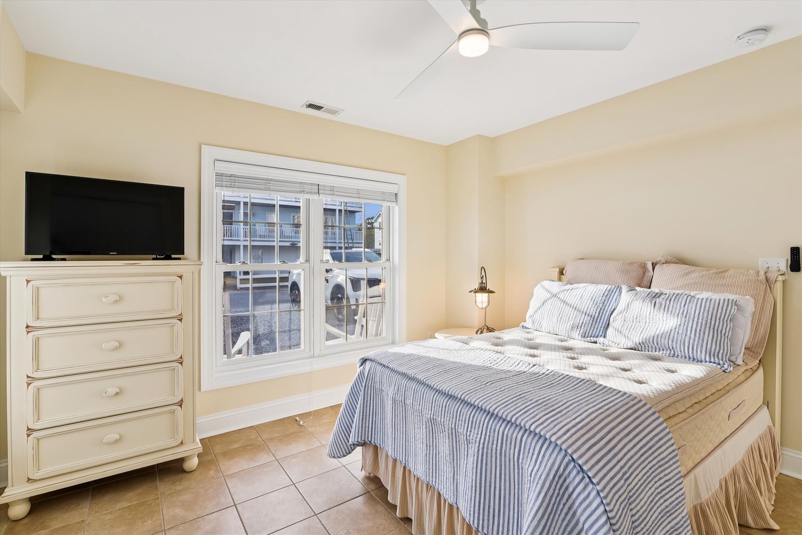Wake up to soft coastal breezes in your serene bedroom retreat, where the morning light spills through waterfront-view windows and nautical-inspired linens await your restful nights.