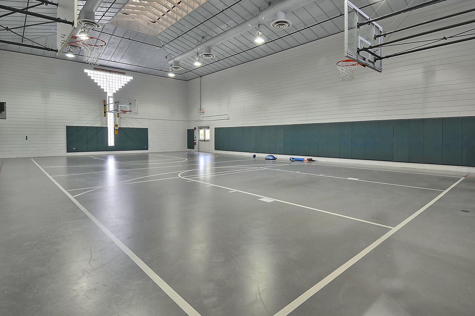 Challenge friends to a pickup game in your own private indoor basketball court, complete with professional hoops and spacious hardwood floors.