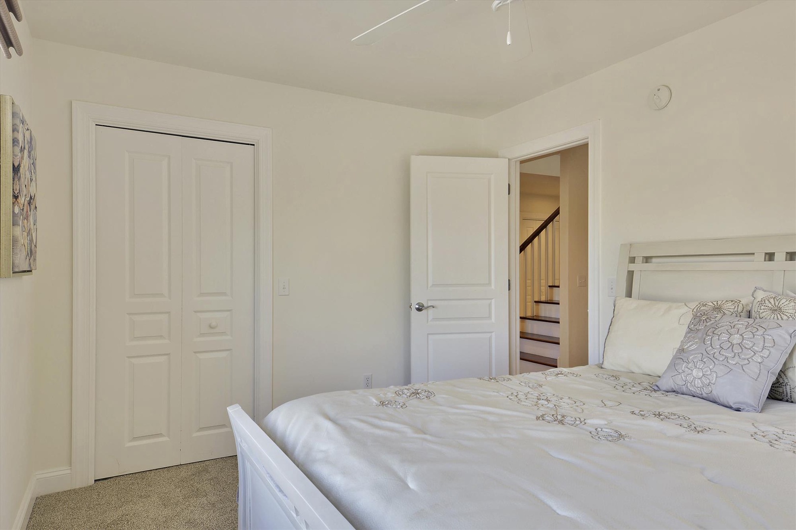 Your peaceful bedroom retreat features a comfortable bed with soft linens, ample closet space, and gentle natural light—perfect for restful nights during your stay.