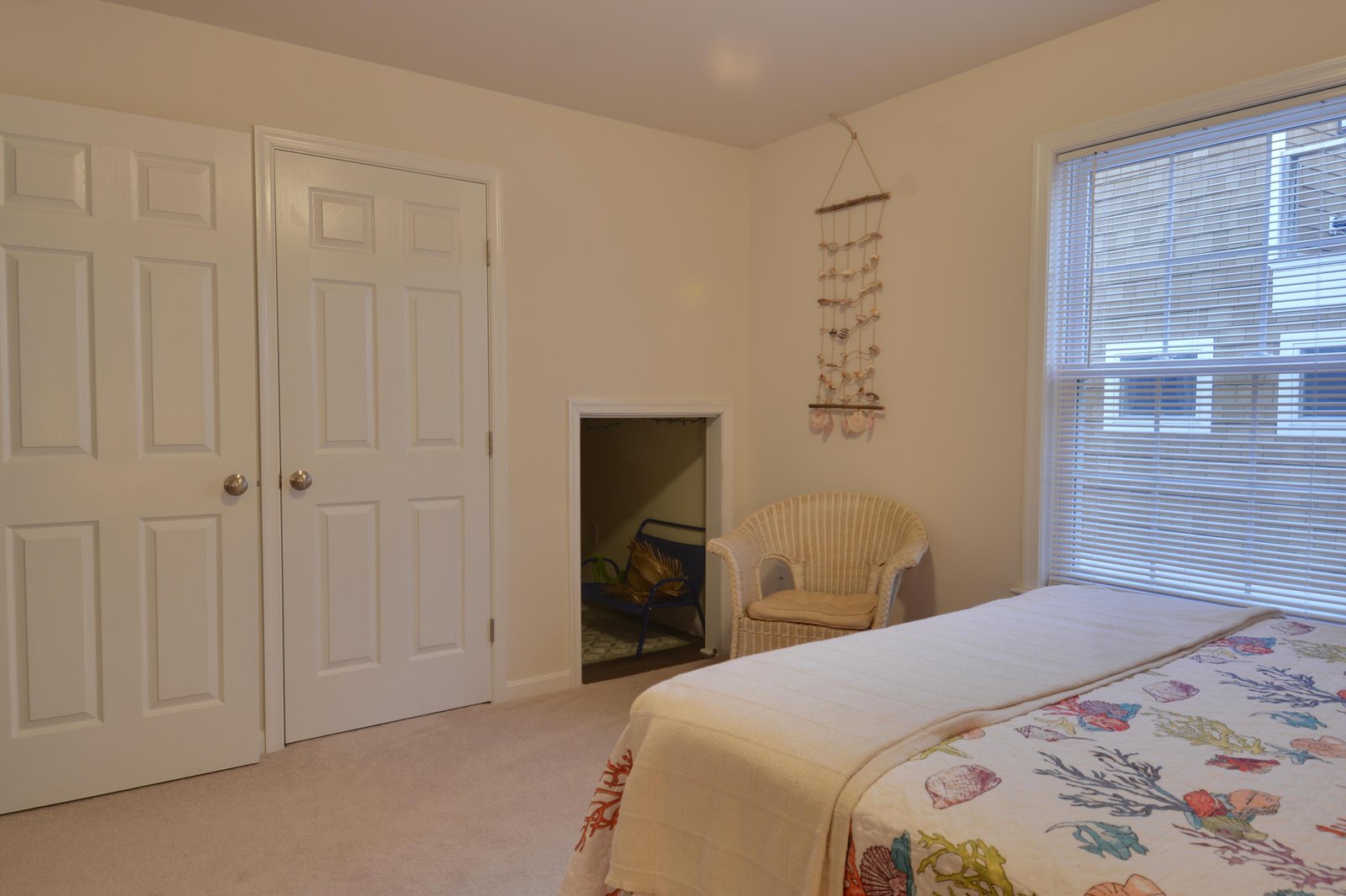 Your cozy retreat features soft natural light, a charming wicker chair, and a peaceful nook perfect for unwinding after a day of exploration.