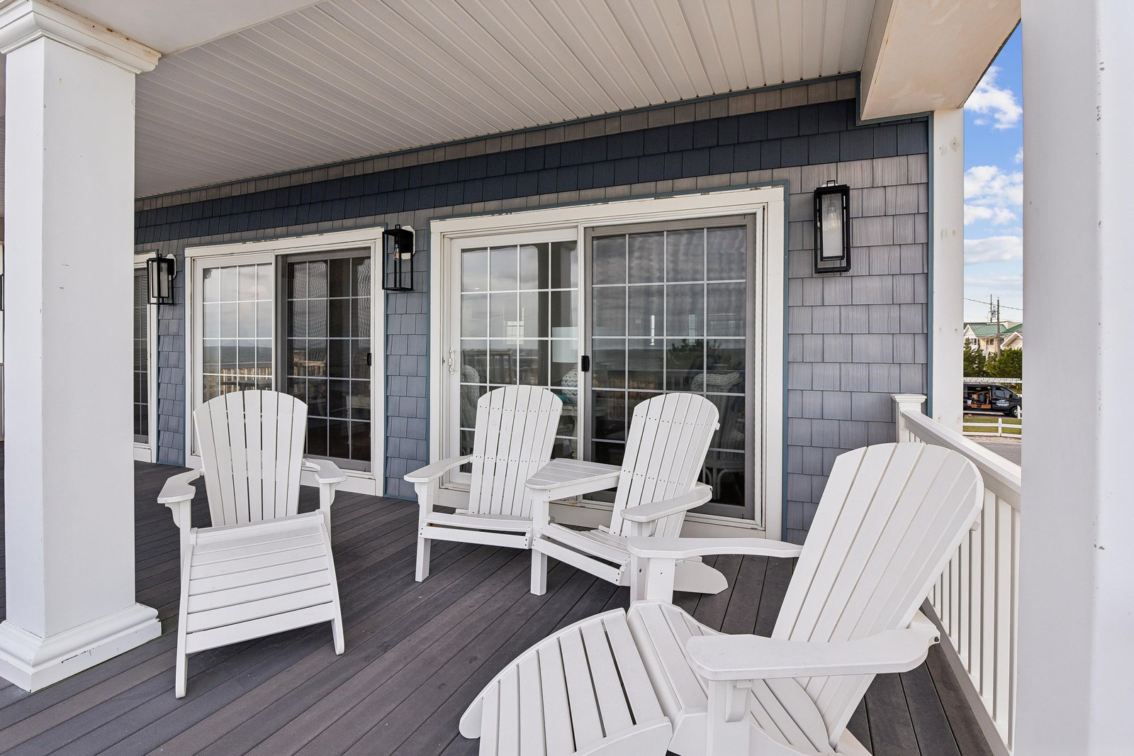 Settle into your private balcony with classic Adirondack chairs and enjoy the open sky. The crisp coastal design invites you to unwind with morning coffee or watch the day drift by in comfort.