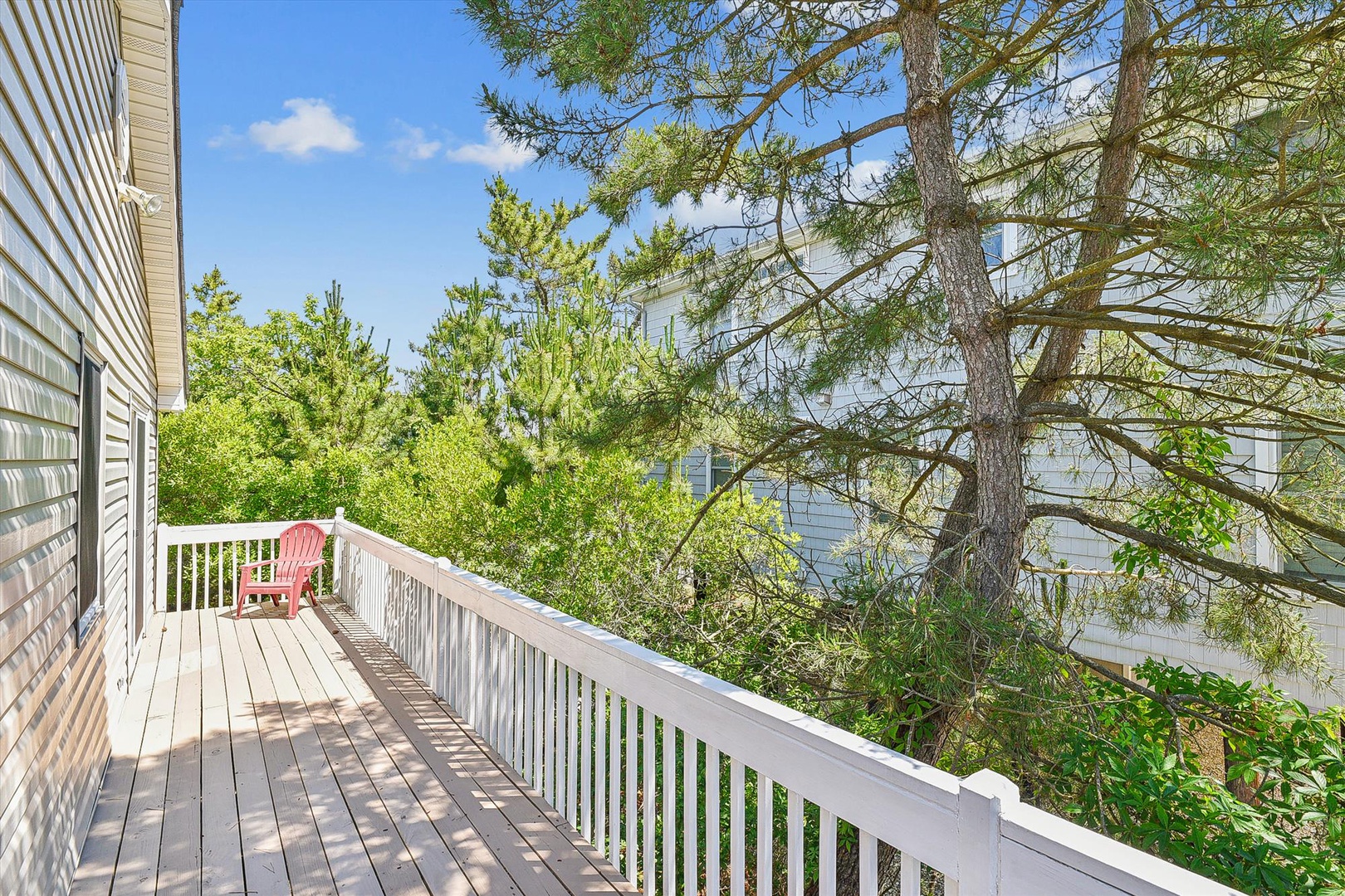 Step onto your private balcony and breathe in the fresh air surrounded by lush greenery. A peaceful spot with a chair awaits for your morning coffee or sunset unwind.