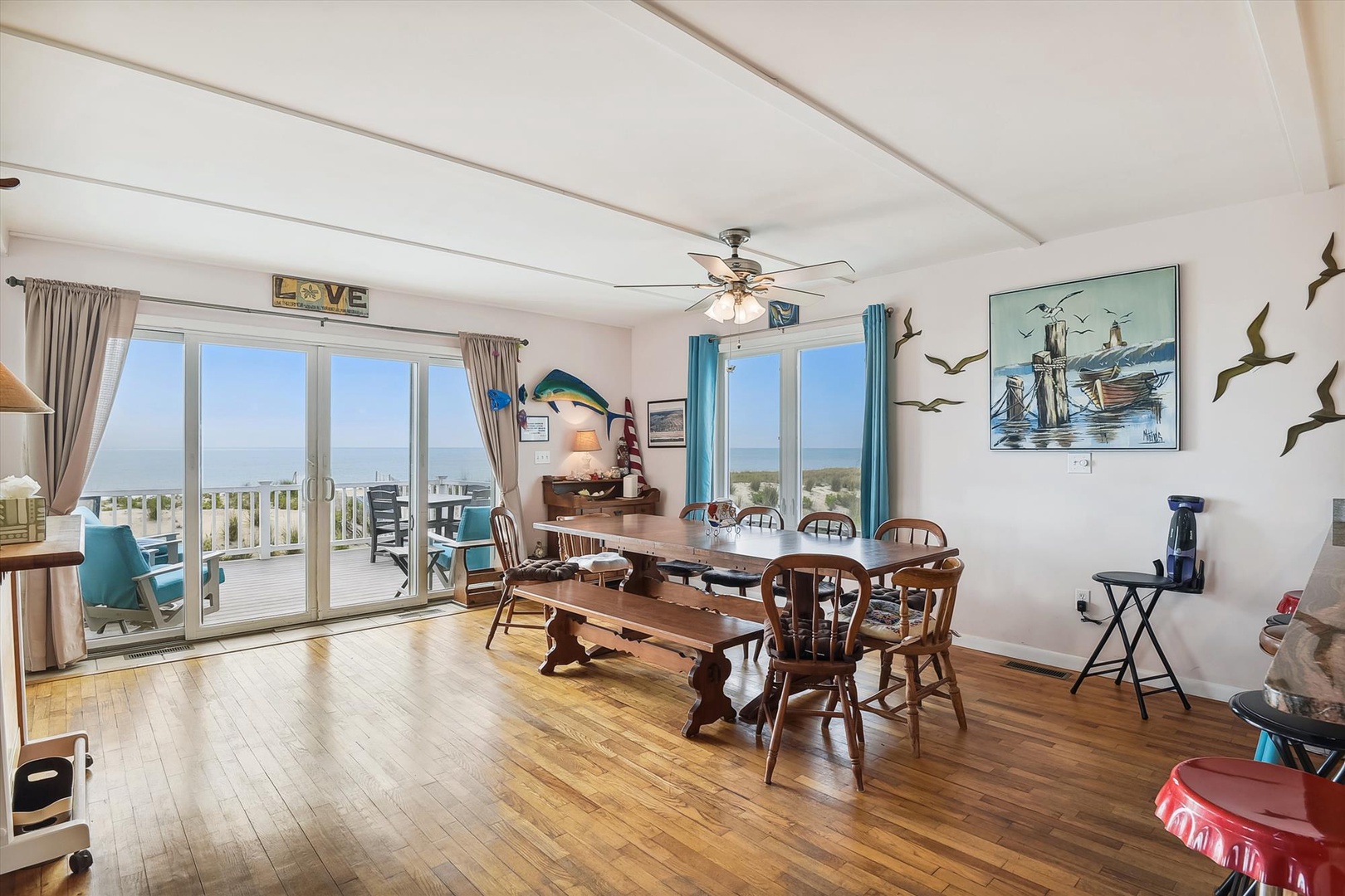 Gather around the rustic dining table where ocean breezes and stunning sea views create the perfect backdrop for your meals and memorable conversations.