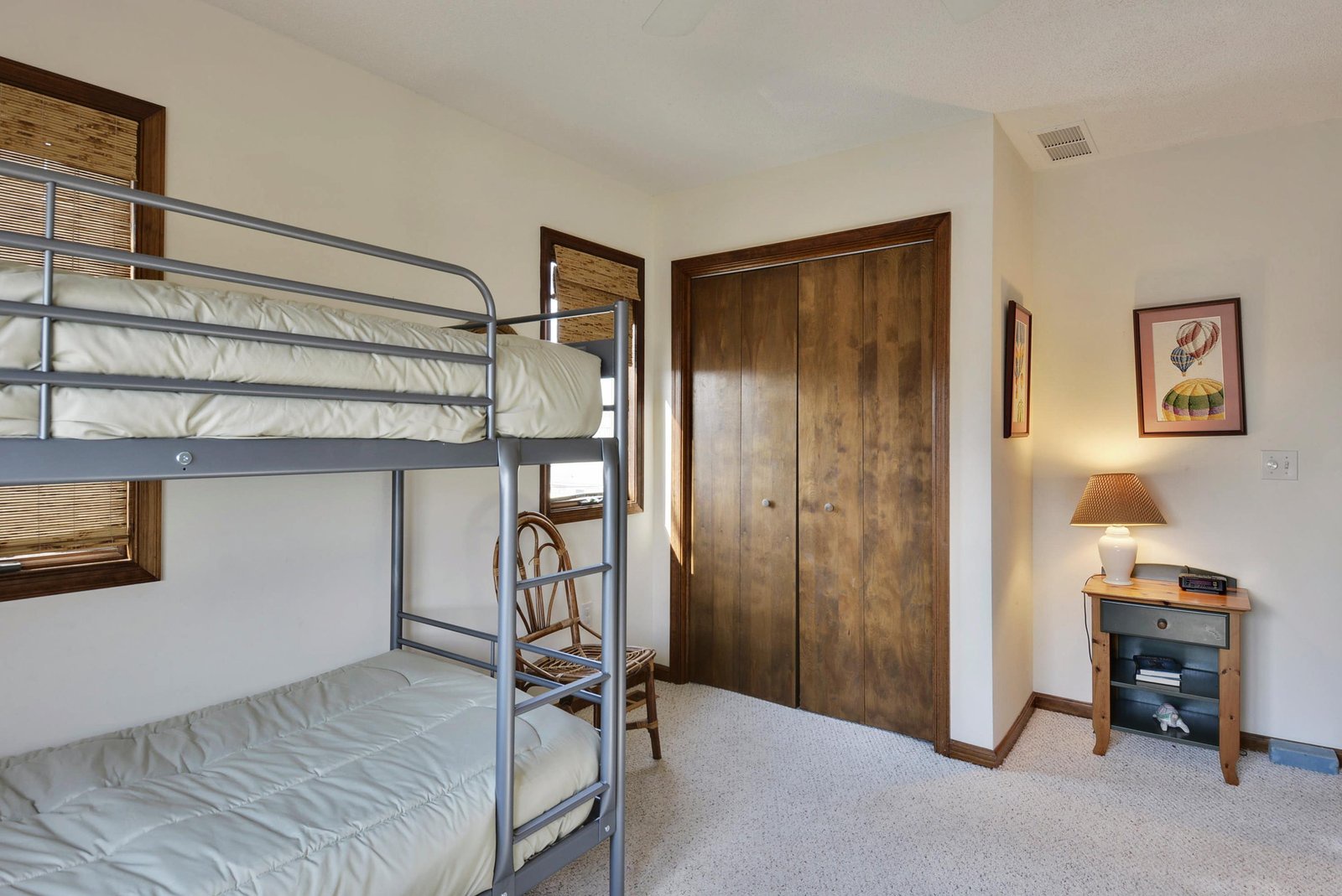 Your family will love this cozy bunk room with twin-over-twin beds and warm wood accents. Perfect for the kids to share stories before drifting off.