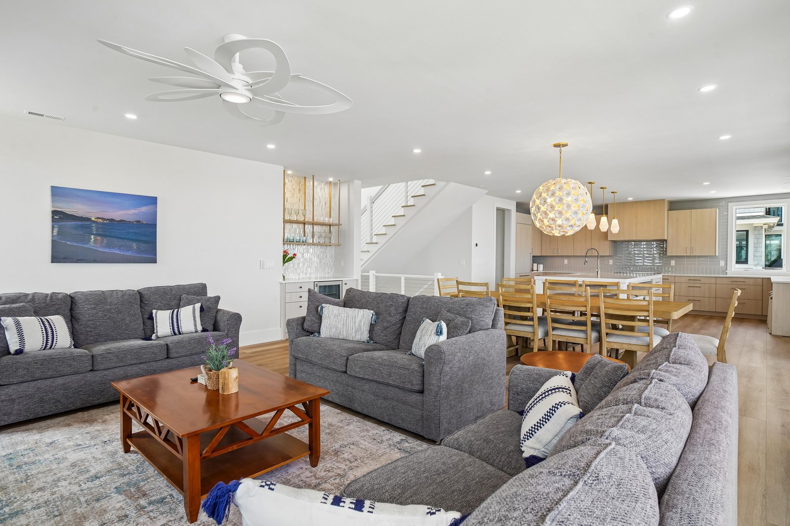 Stretch out in your open-concept living space with plenty of room for everyone. Sink into comfortable seating, gather around the dining table, and enjoy the bright, airy feel throughout.