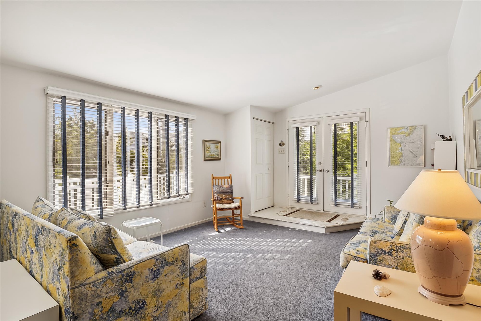Settle into the comfortable seating with natural light streaming through the windows, creating a warm and welcoming space for your relaxation.
