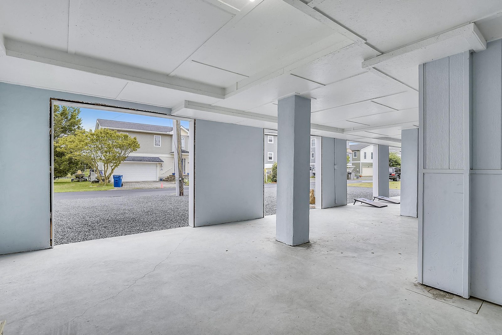 A spacious covered parking area with secure storage offers convenient and protected space for vehicles and gear, keeping your belongings safe and sheltered during your stay.
