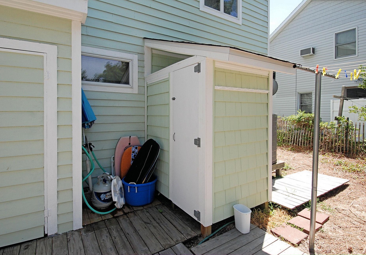 Convenient outdoor storage shed in the backyard provides space for beach gear and outdoor equipment during your stay.