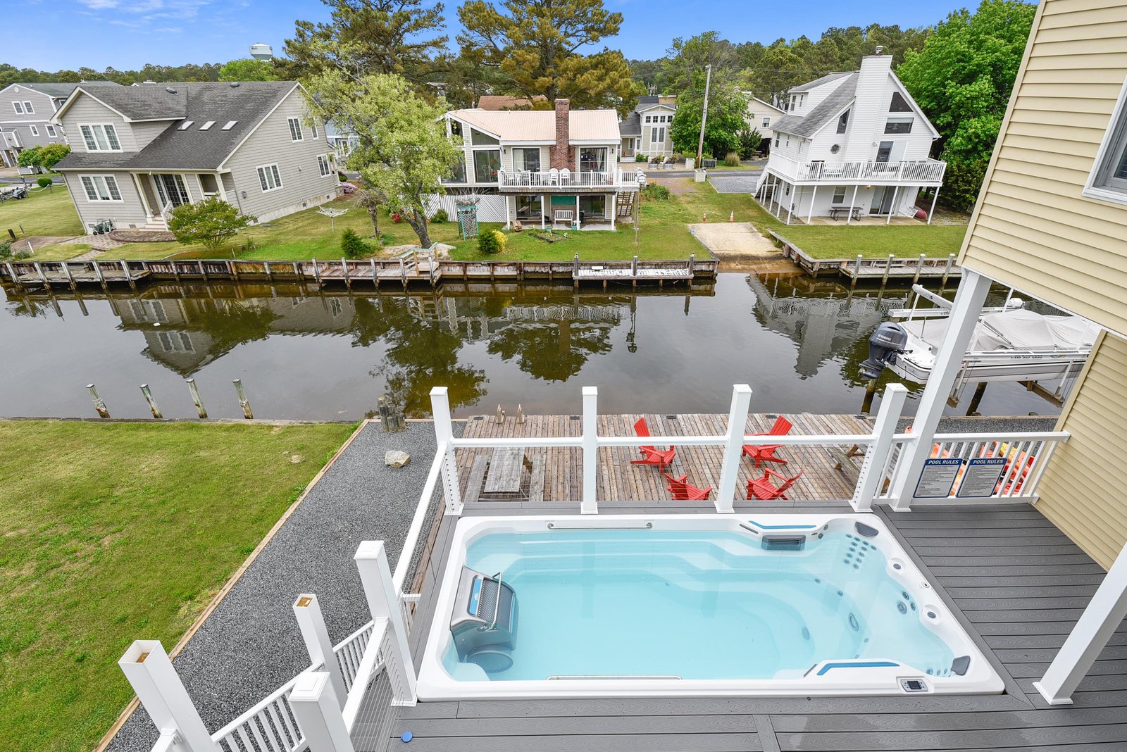 Step onto your private deck and sink into the hot tub while gazing over calm waterfront views—your own peaceful escape awaits.