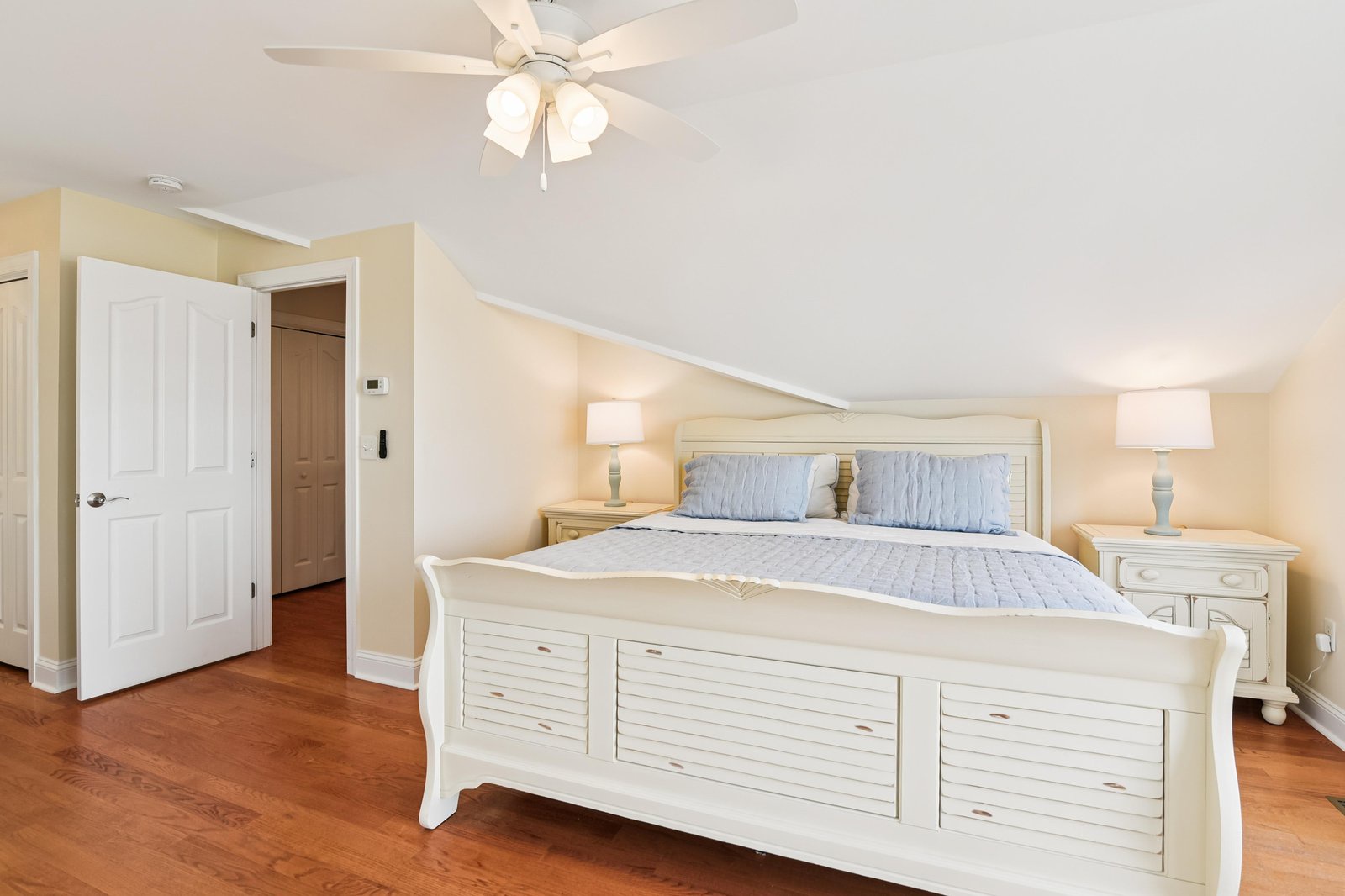 Sink into this peaceful retreat with its coastal-inspired furnishings and warm hardwood floors. Your ceiling fan keeps things comfortable while matching nightstands add charm and convenience.