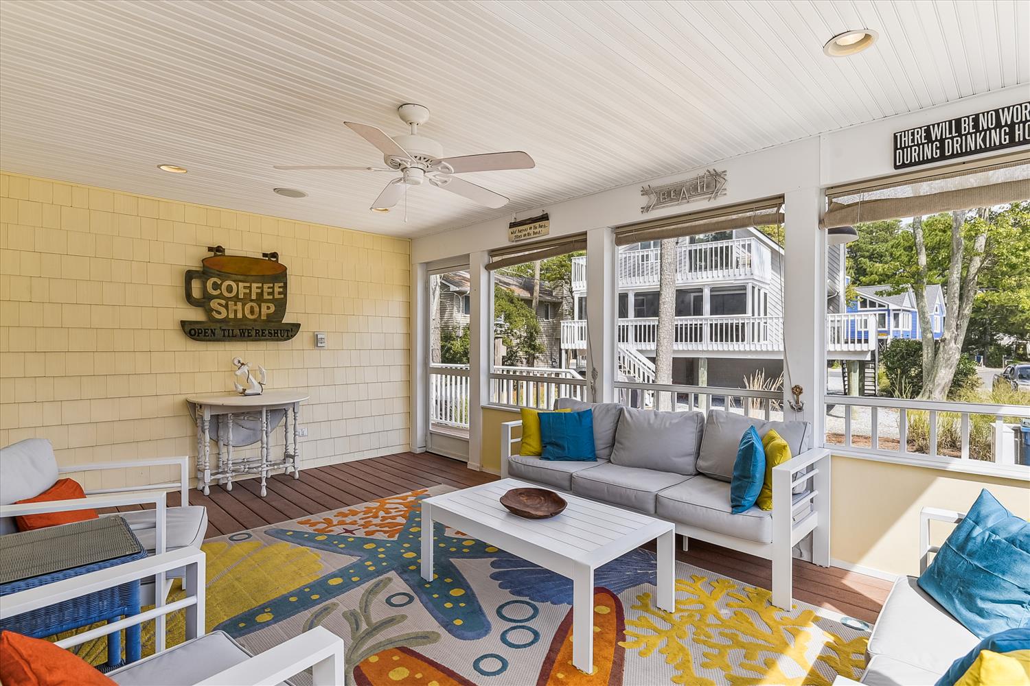 Settle into your private screened porch and enjoy the coastal breeze. Bright pops of color and comfy seating invite you to linger with morning coffee or an evening drink.