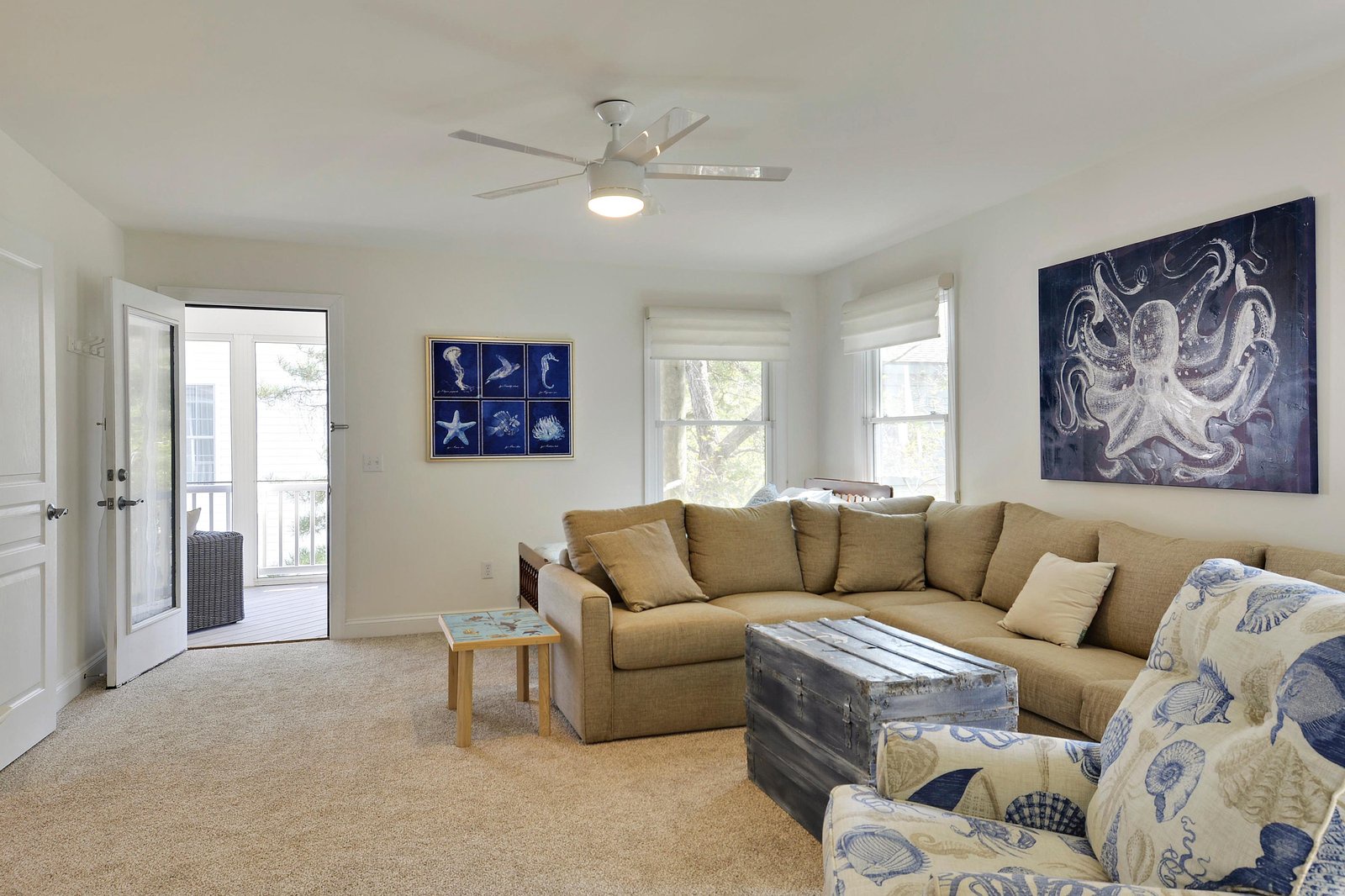 Unwind in your coastal-inspired living room, where plush seating and ocean-themed décor invite you to settle in and make yourself at home after a day at the beach.