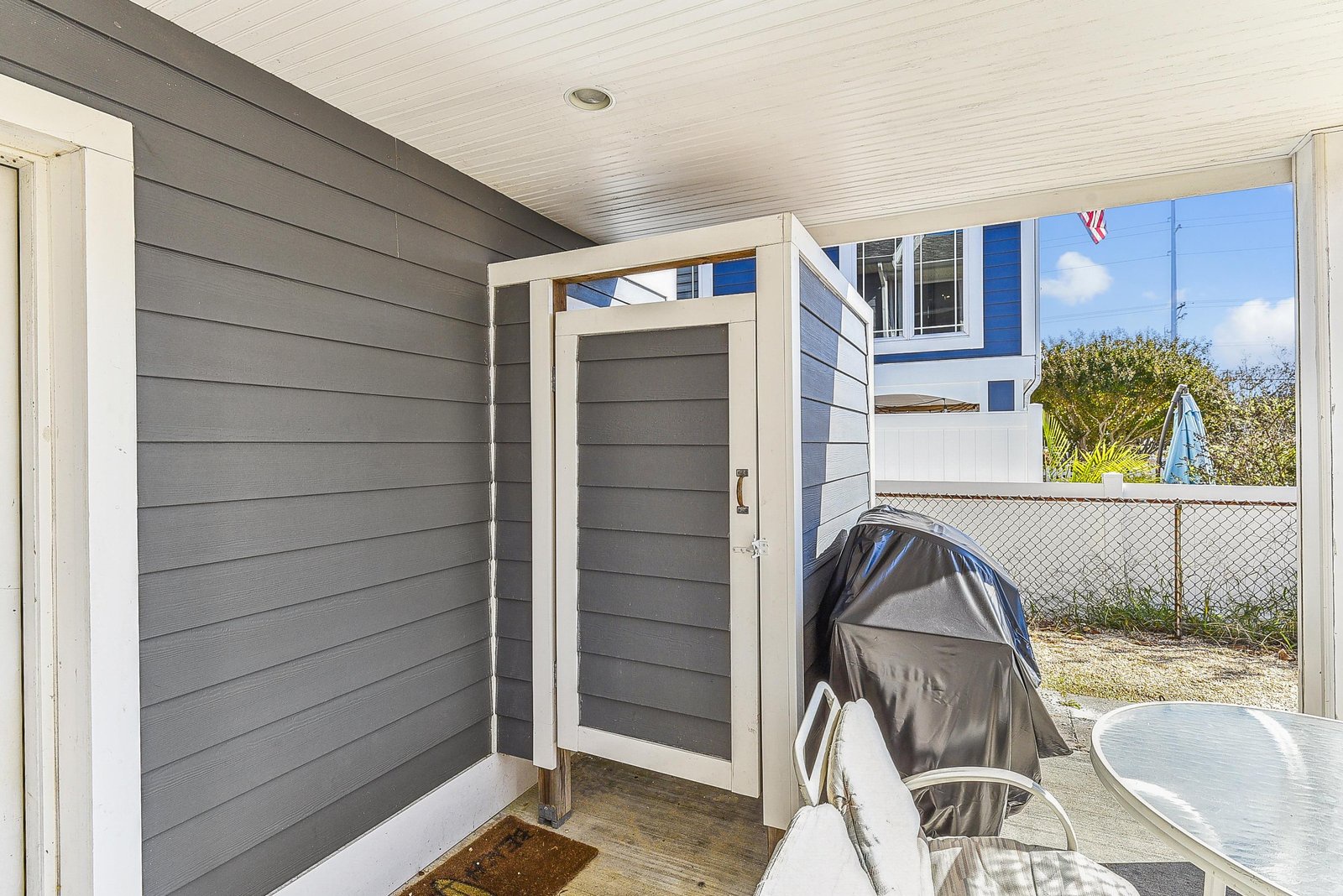 Your private patio includes a covered grill and seating area, ready for coastal cookouts and morning coffee under the open sky.