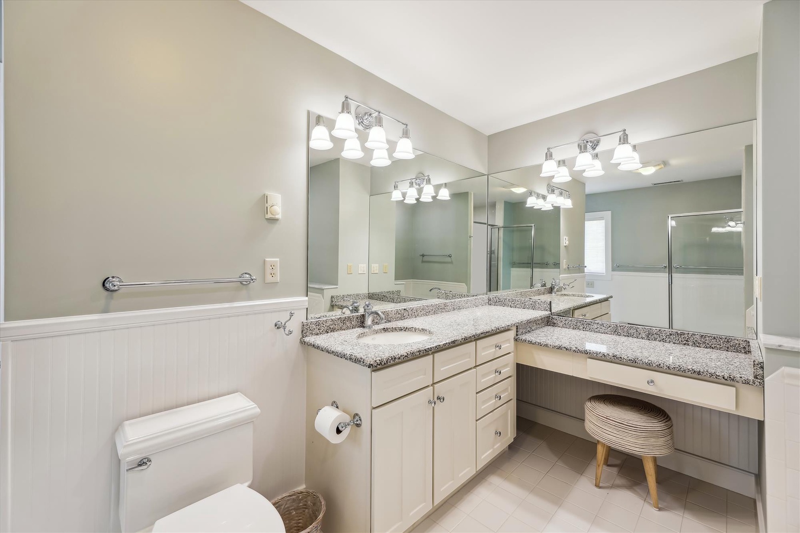 Your spacious bathroom features dual vanities with granite countertops, bright vanity lighting, and a convenient built-in makeup area—perfect for getting ready for the day ahead.