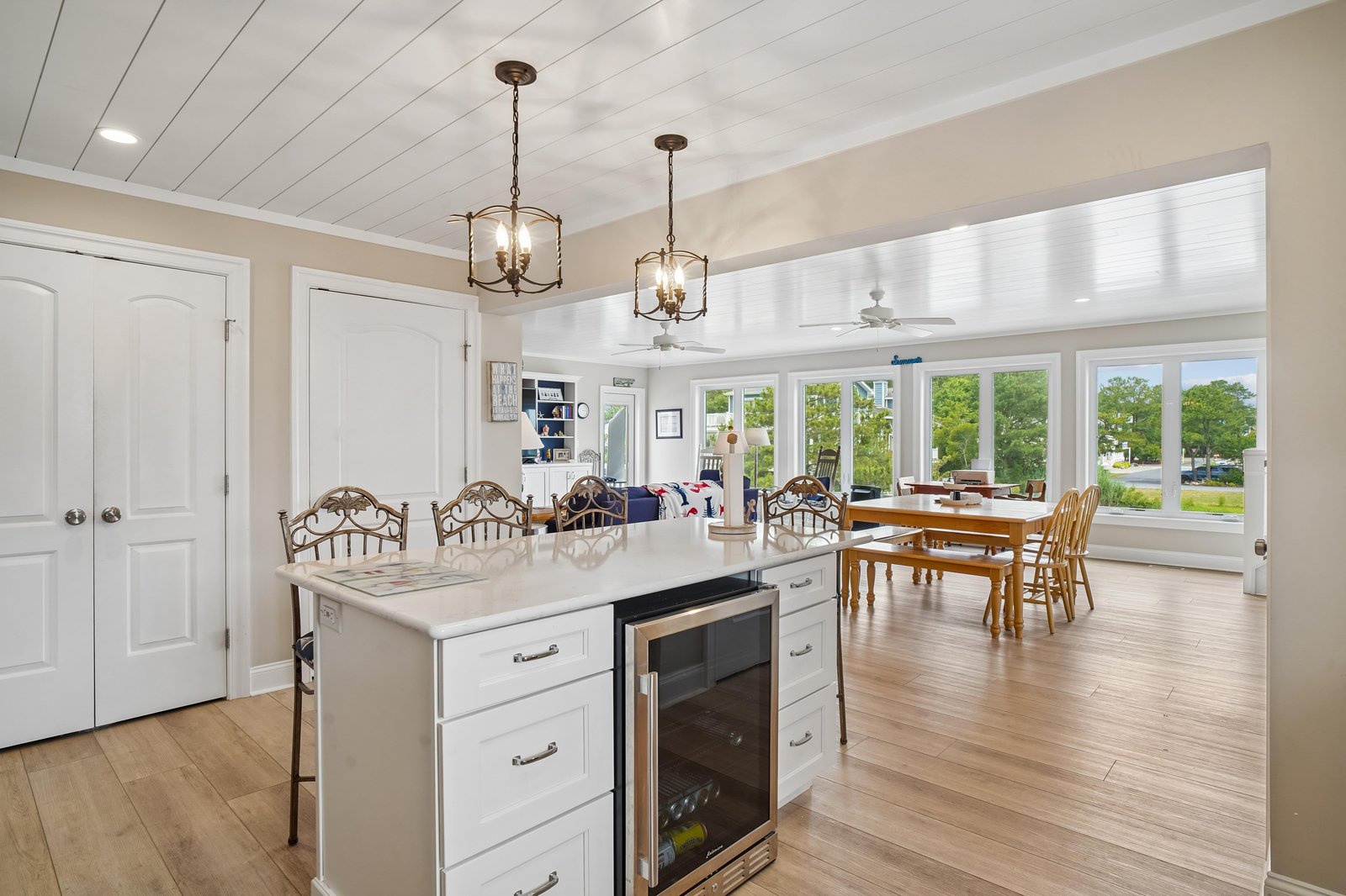 Gather around your bright kitchen island or enjoy meals at the dining table, where sunlight streams through expansive windows and every detail invites you to relax and connect.
