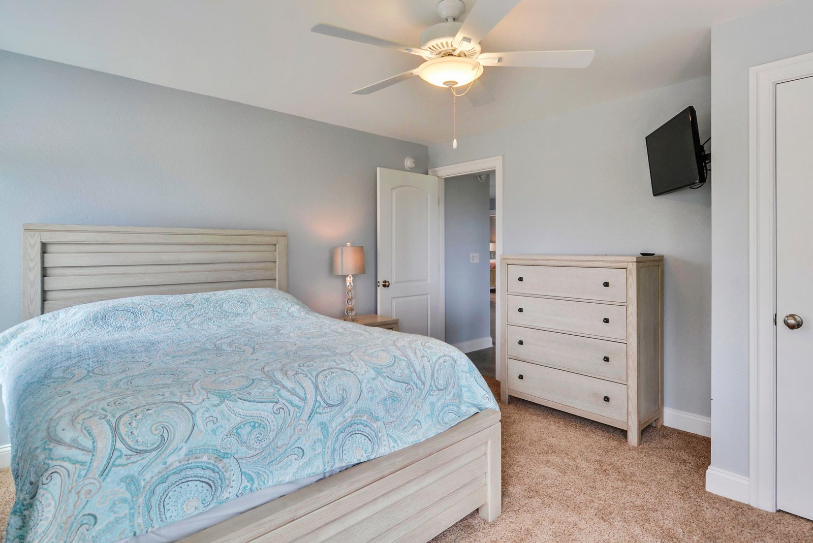 Your peaceful bedroom awaits with a plush bed, ceiling fan, and all the comforts you need to unwind after a day of adventure.