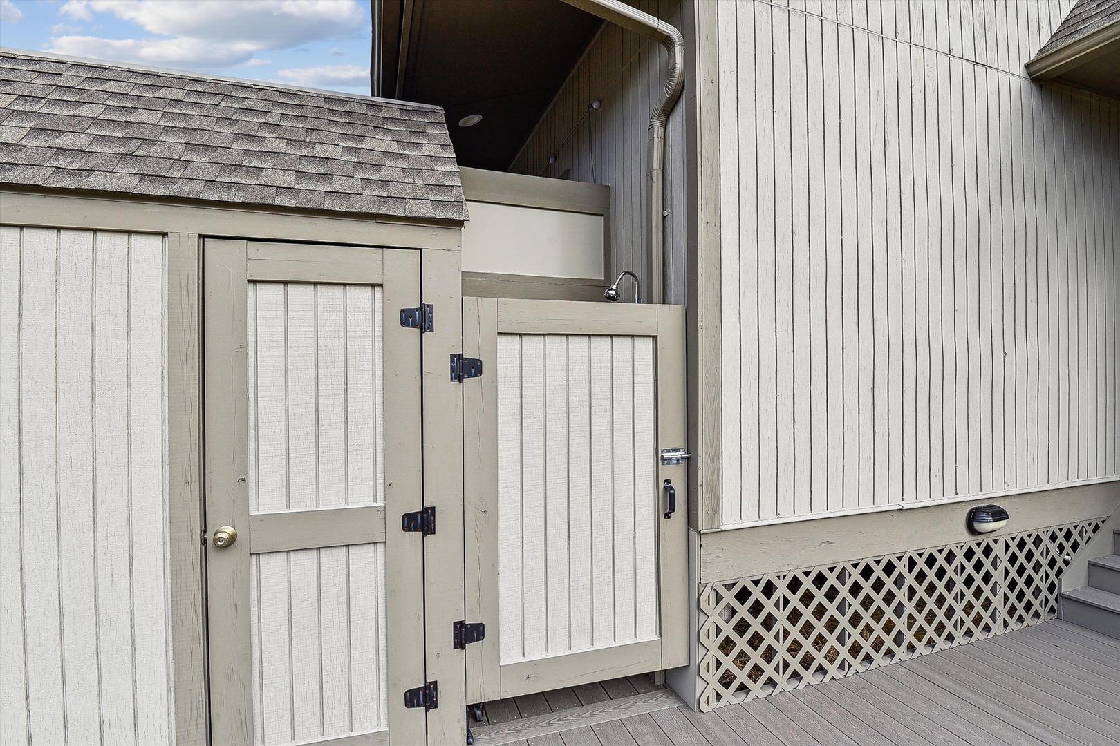 This private outdoor deck features a charming barn door entrance and plenty of space to relax in the fresh air.