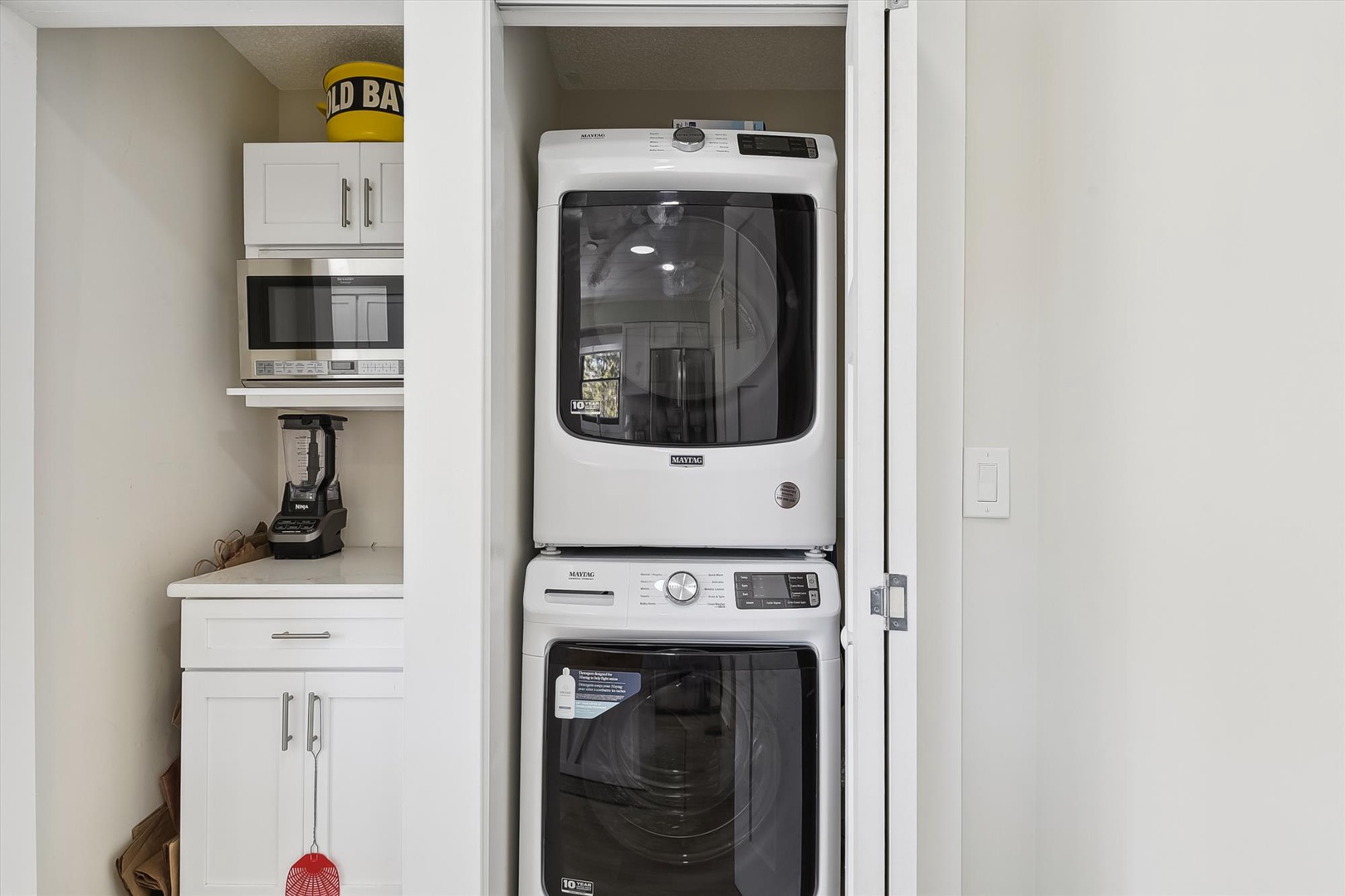 Your own in-unit washer and dryer tucked neatly into a closet, plus a microwave and counter space for your everyday convenience.