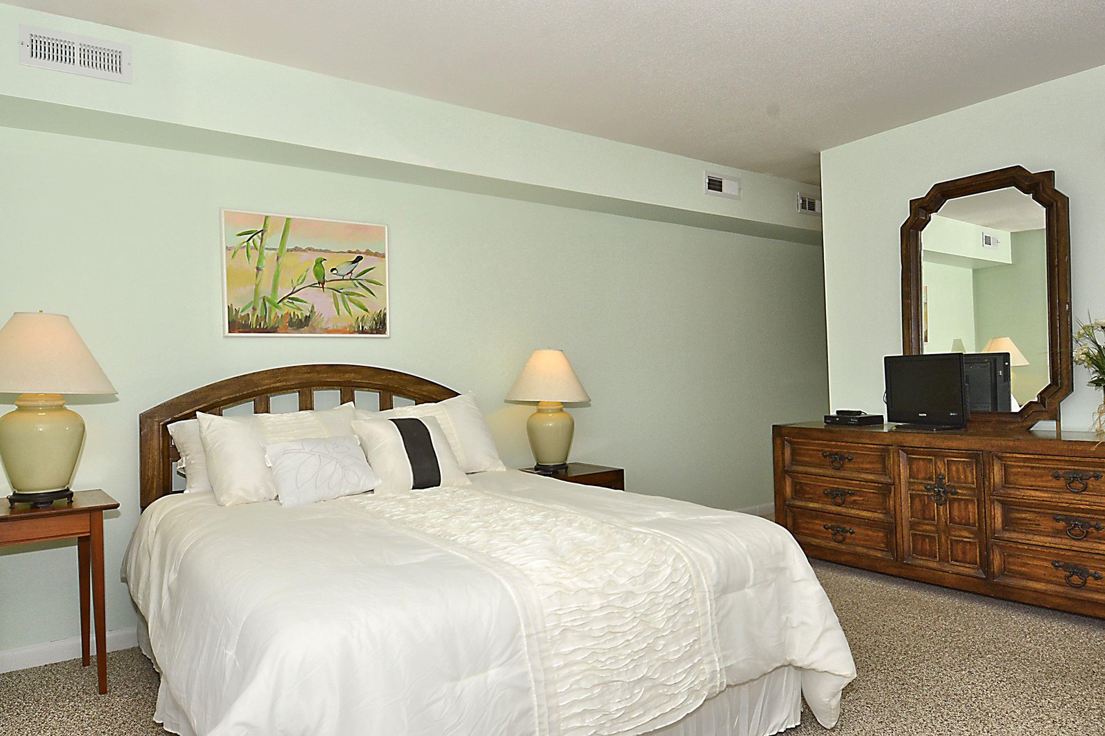 Settle into plush bedding and unwind in your peaceful retreat, complete with soft lighting and all the comforts you need for a restful stay.