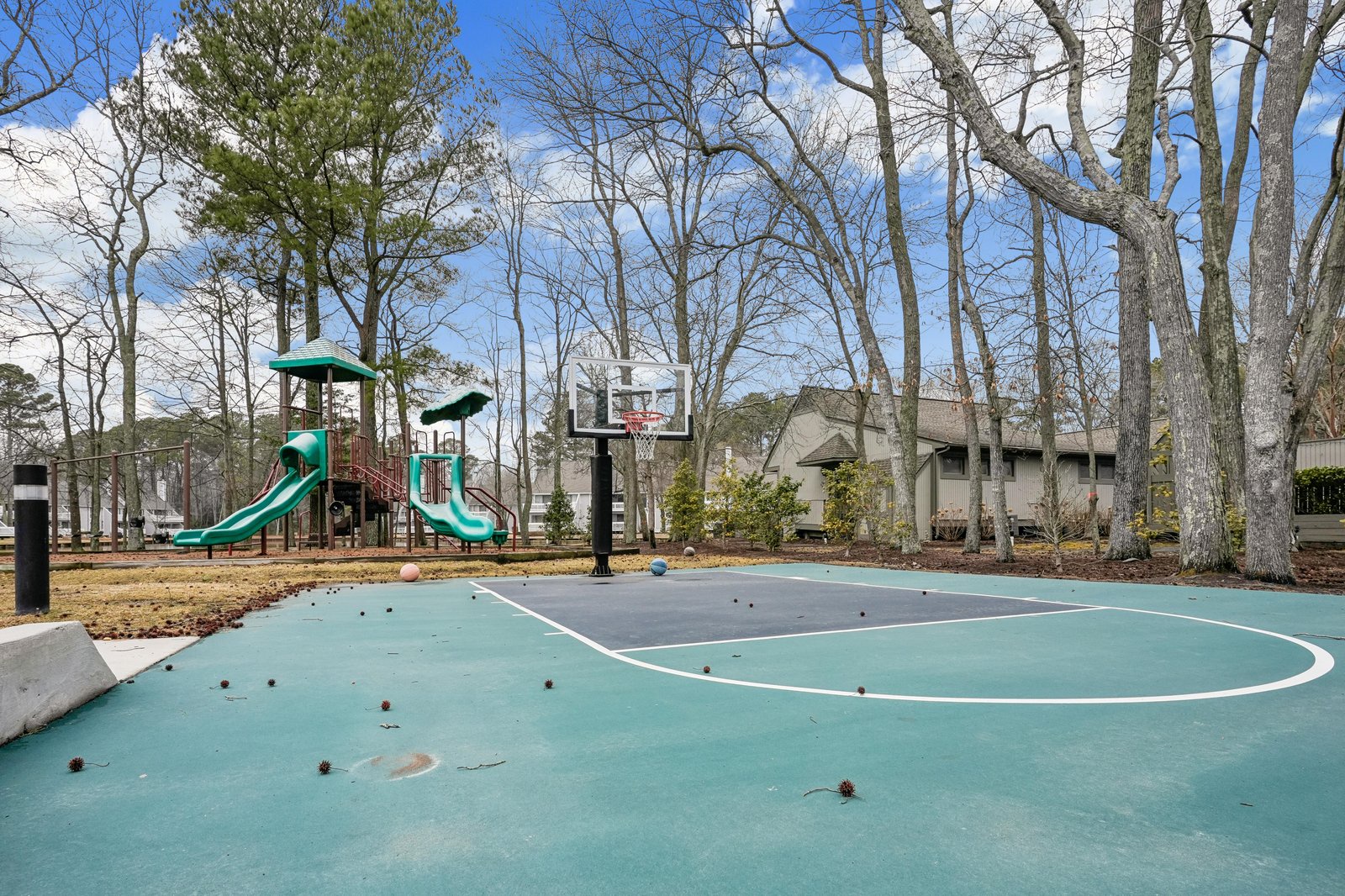 Community basketball court, playground with slides, and sport court available on property grounds—located steps away from the rental for outdoor fun.