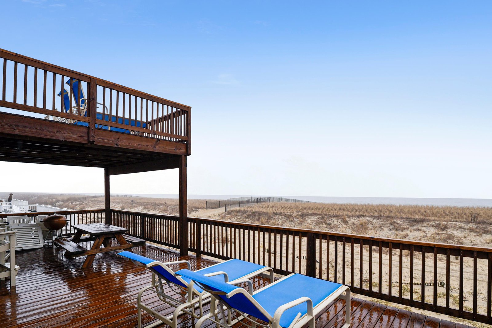 Soak up coastal breezes from your private multi-level deck with oceanfront views, complete with lounge chairs and outdoor dining for memorable seaside meals.