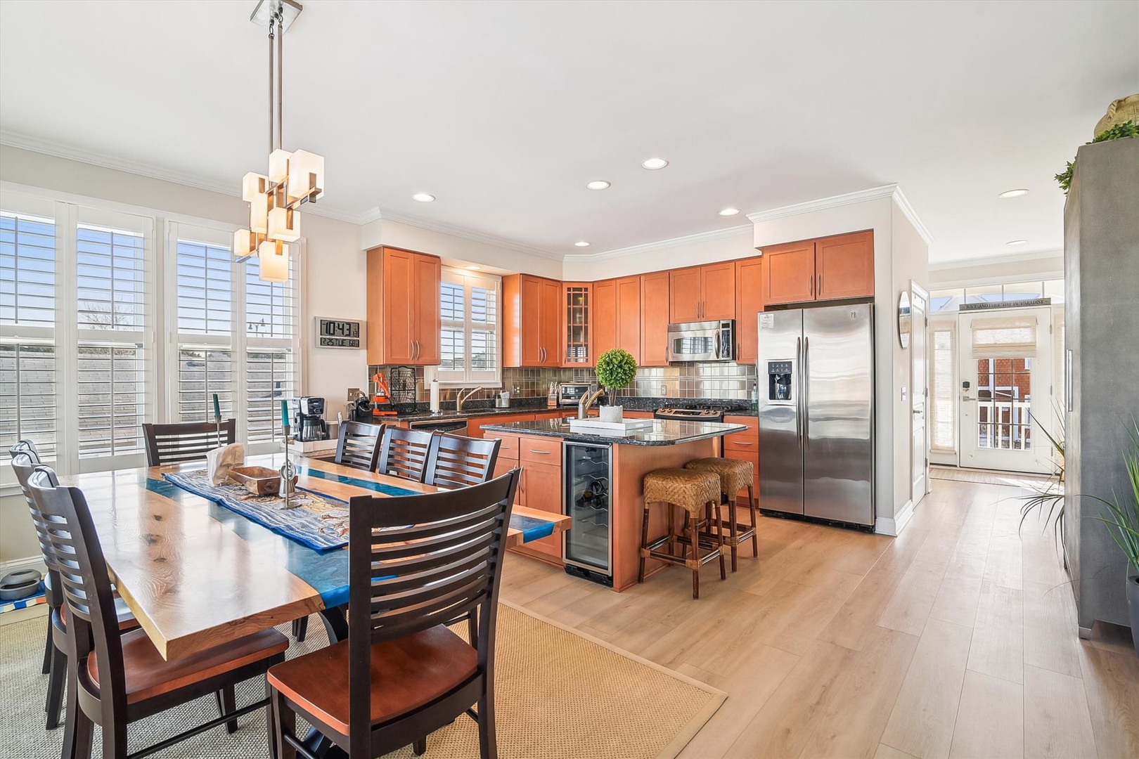 Gather around this bright, fully-equipped kitchen with gleaming counters, stainless appliances, and a dining table perfect for sharing meals and making memories with your group.
