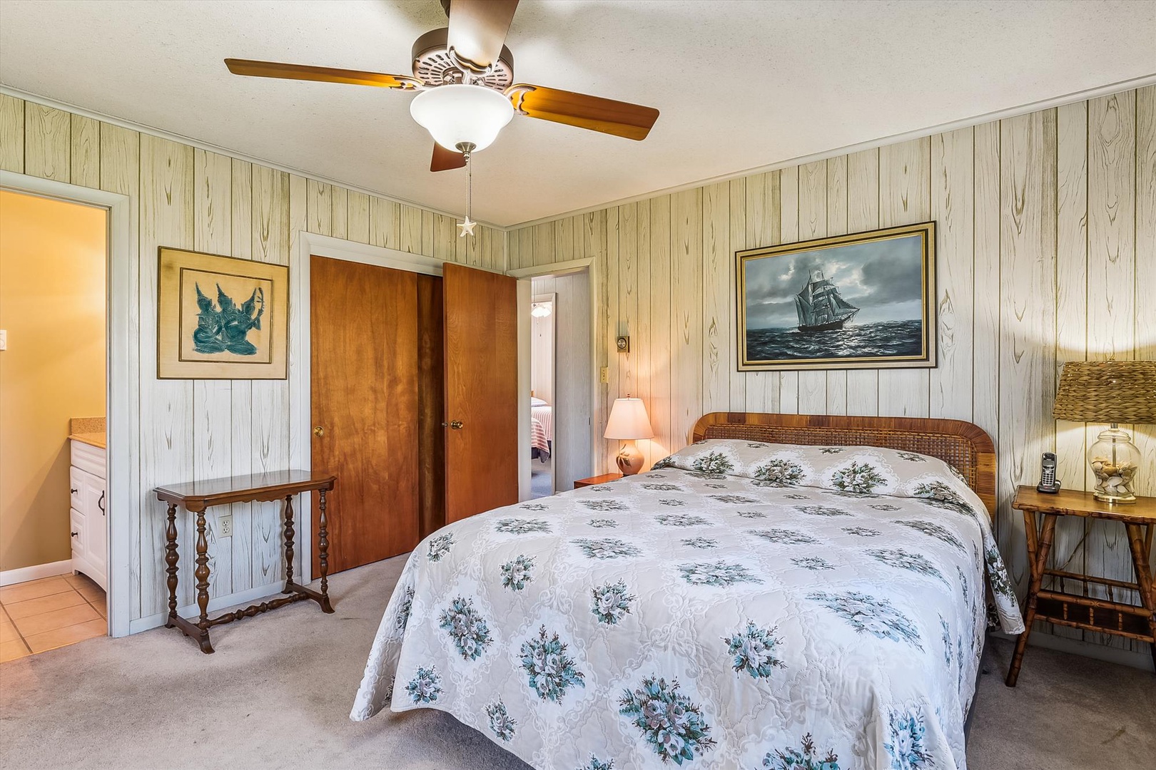 Unwind in your charming nautical-themed bedroom, where coastal decor and a comfortable rattan bed invite restful nights after seaside adventures.