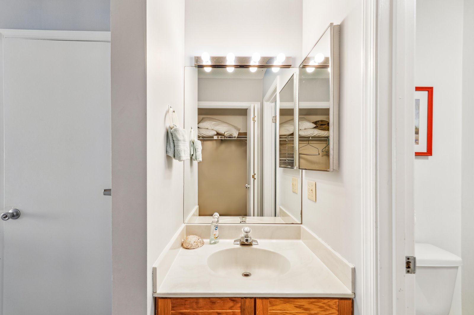 Freshen up at your private vanity with bright lighting and a sleek, spacious counter for your essentials.