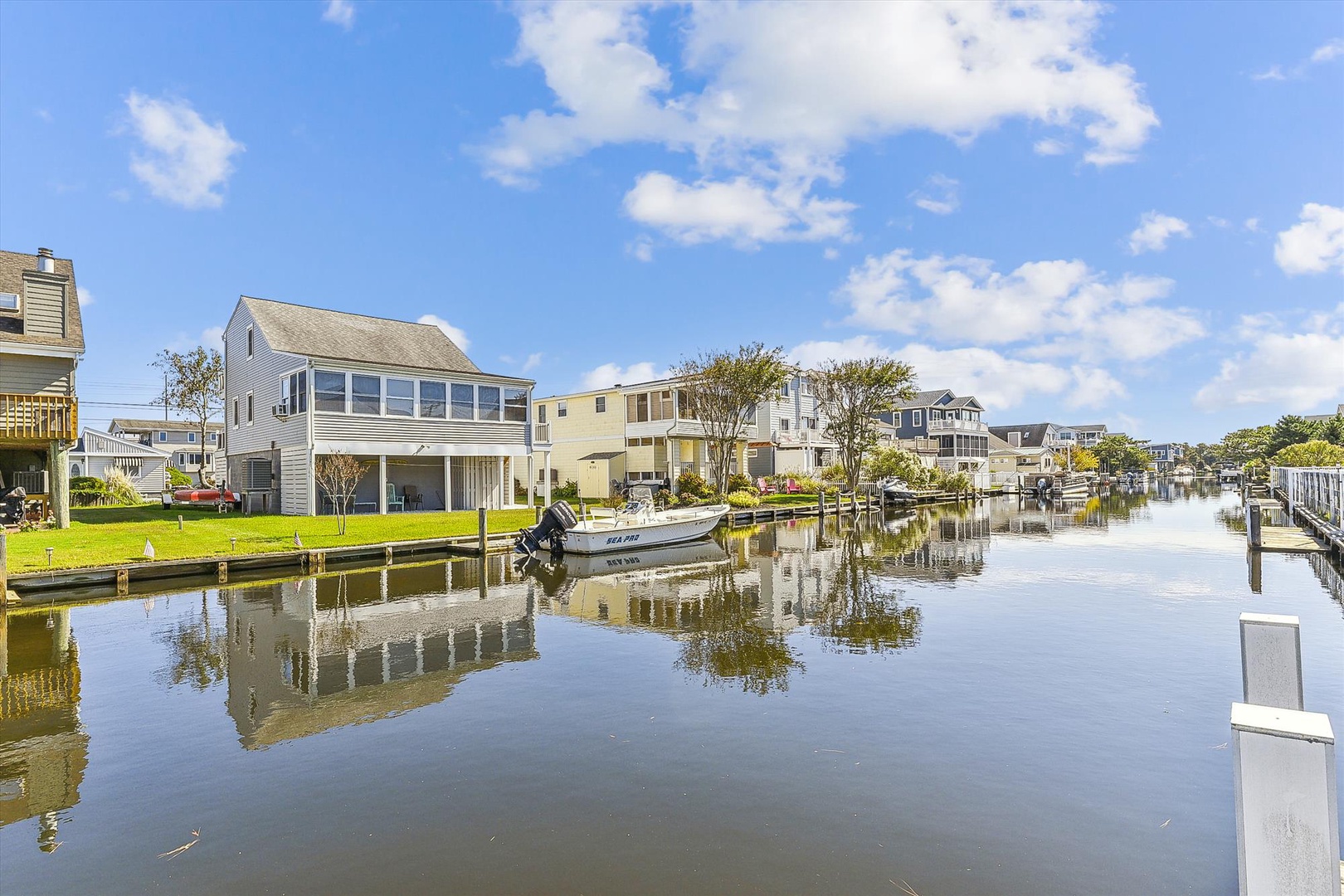Waterfront community with private docks and canal access, offering a peaceful coastal neighborhood setting.