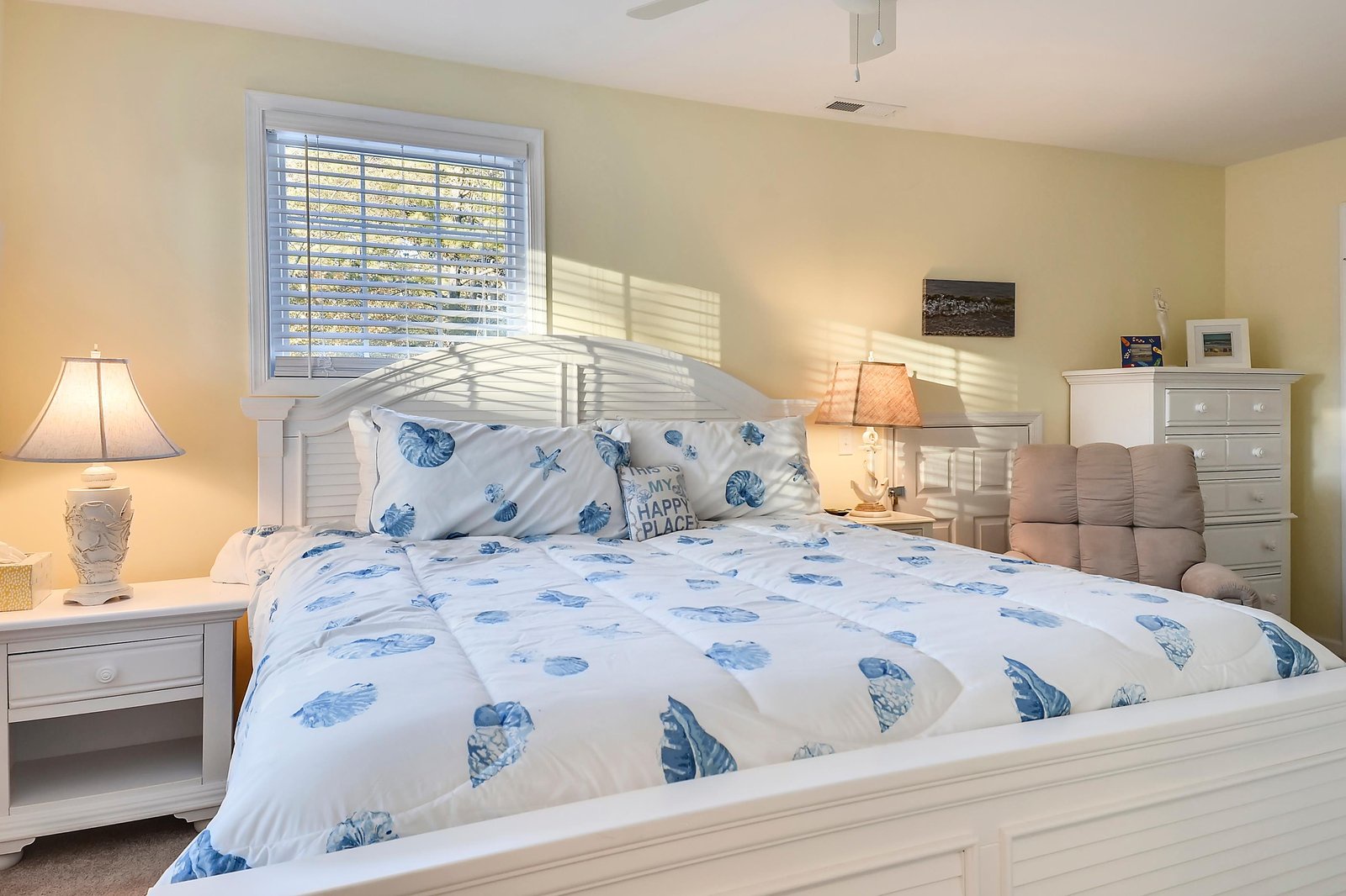 Slip into coastal comfort in this serene bedroom, where soft linens and warm natural light invite you to unwind and recharge.