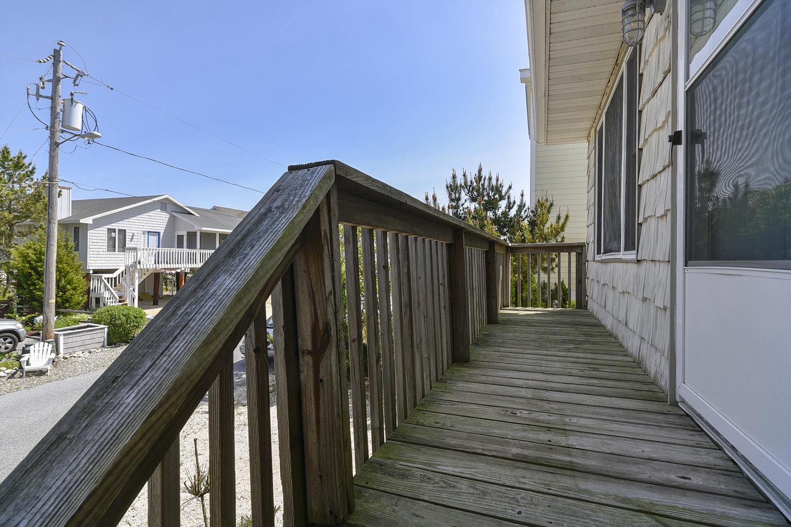 Accessible entrance ramp with sturdy railings leads directly to the property, ensuring easy arrival and departure for all guests with smooth, secure access.