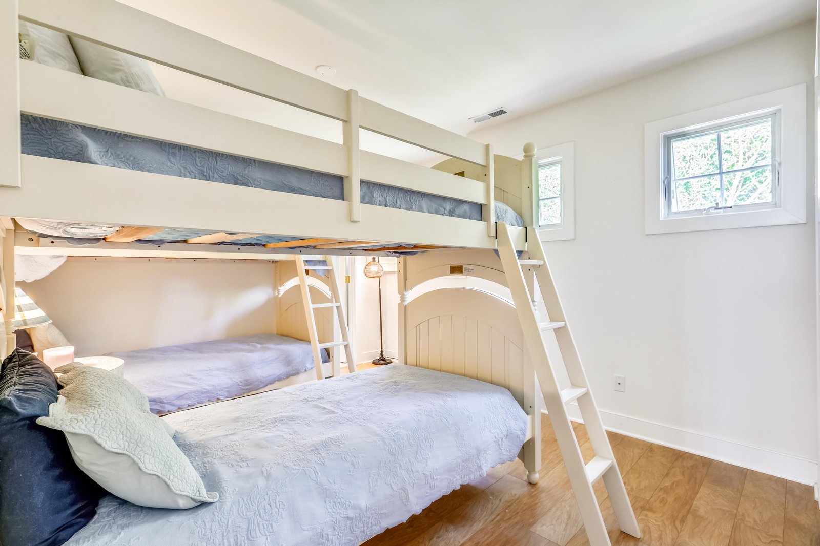 Your kids will love claiming their favorite bunk in this bright, inviting room—soft linens, natural light, and plenty of space to settle in and feel right at home.