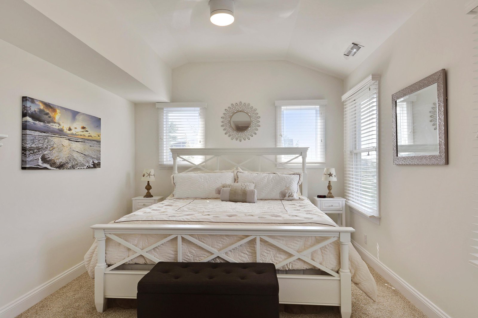 Slip into crisp linens and unwind in your bright, peaceful bedroom, where coastal touches and natural light create a soothing retreat after a day of adventure.