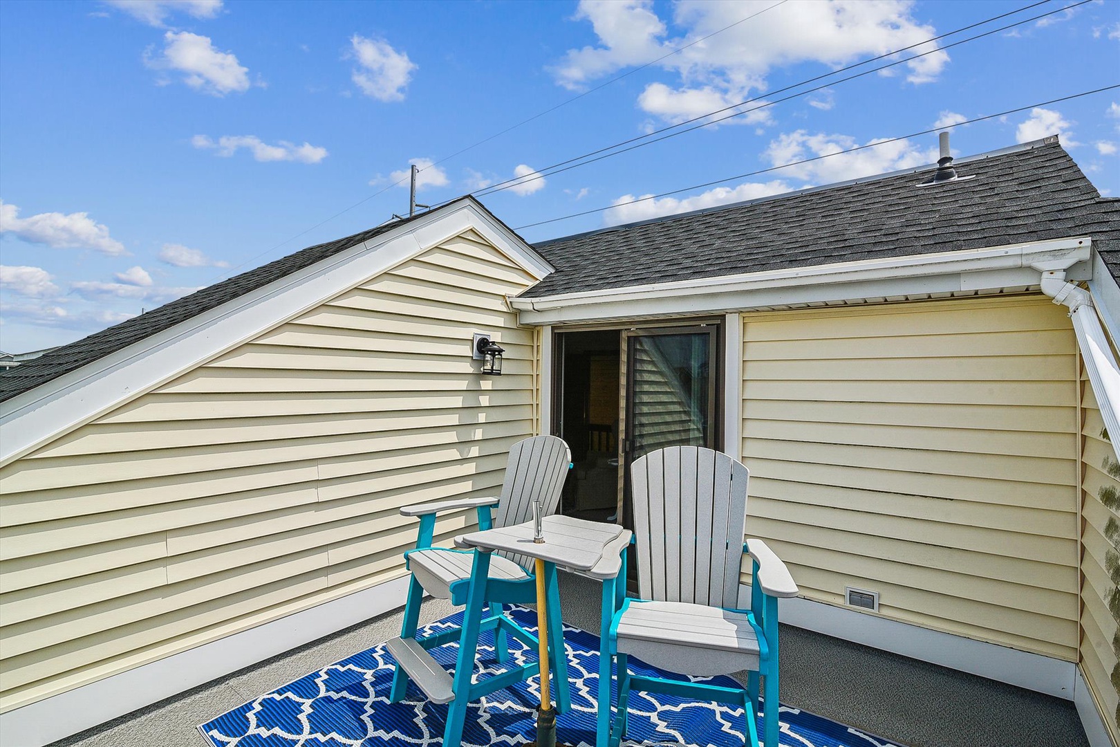 Settle into these cozy Adirondack chairs on your private rooftop deck, where bright blue skies and fresh air invite you to unwind with morning coffee or evening conversations.