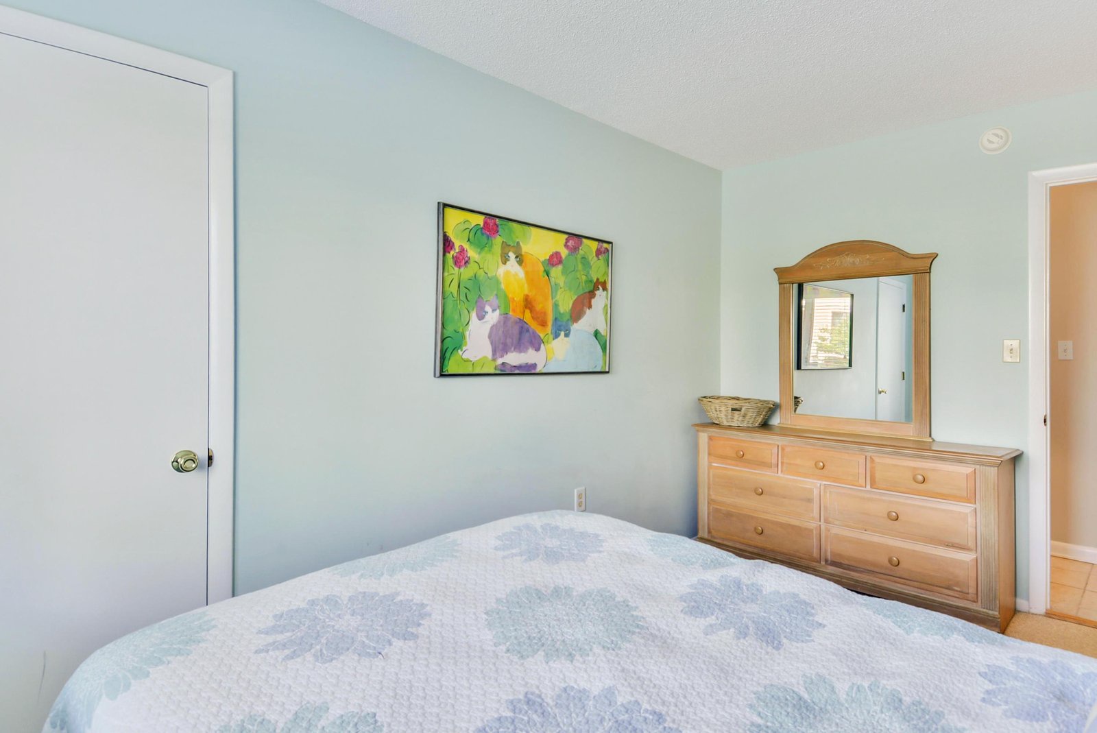 Wake up refreshed in this serene bedroom, where soft blue tones and warm wood furnishings create your perfect coastal retreat. Unpack and unwind with plenty of storage for all your vacation essentials.