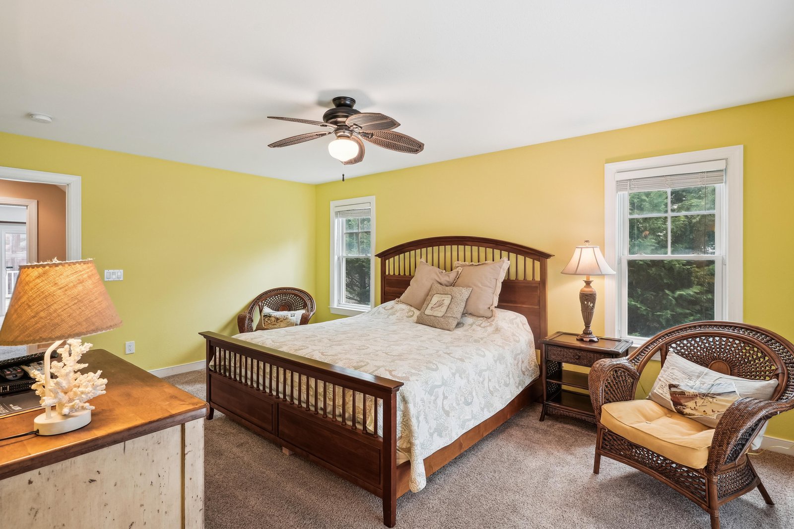 Sink into your comfortable bed and wake up to natural light streaming through twin windows. The cheerful atmosphere and cozy furnishings create the perfect retreat after a day of exploring.