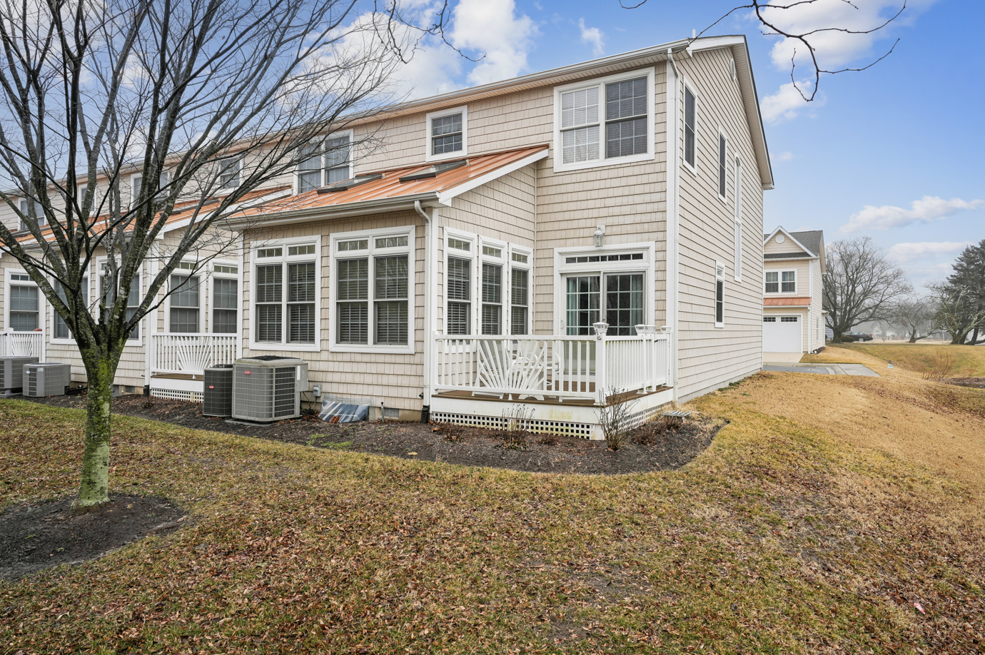 Charming two-story home features bright windows and peaceful neighborhood setting for your getaway.