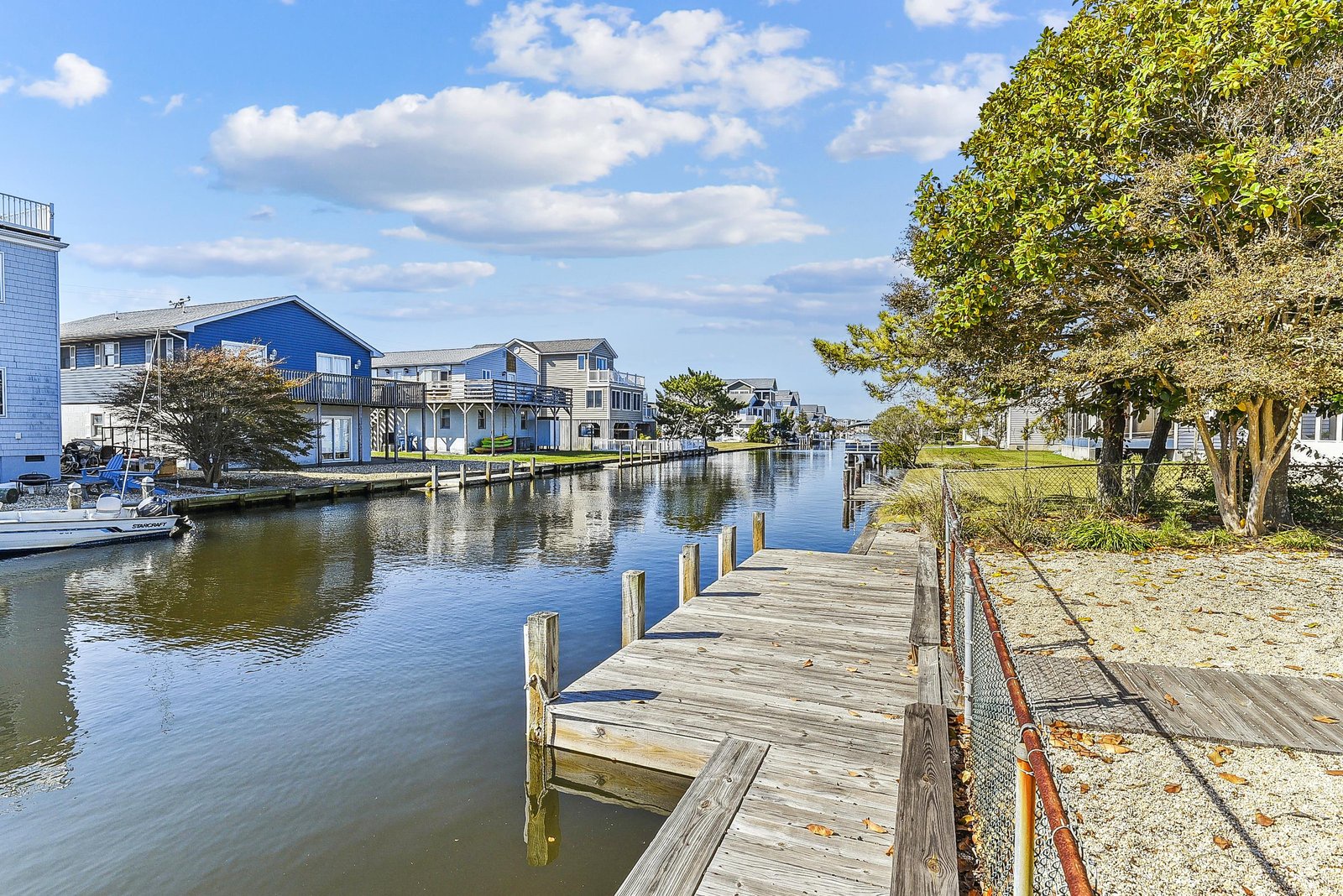 This waterfront community features private boat docks along a calm canal, offering easy access to the water and peaceful neighborhood surroundings.