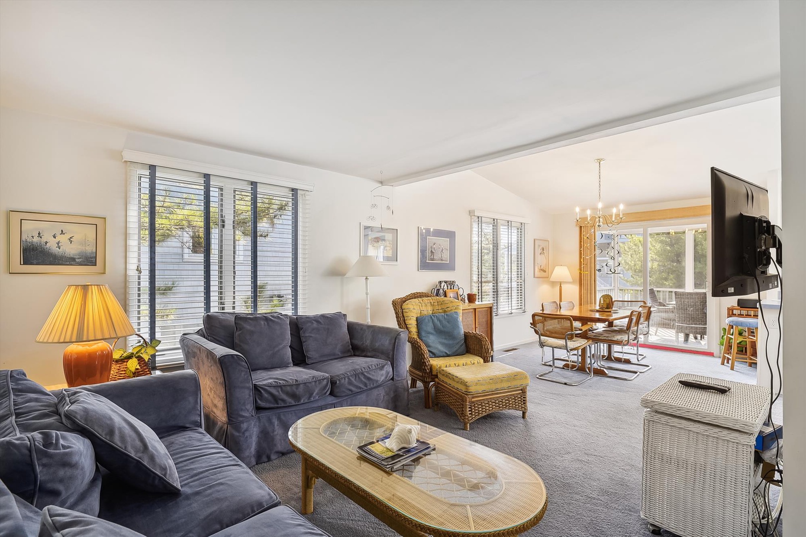 Your spacious living area features plush seating, abundant natural light through large windows, and a cozy dining space that opens to a private deck with garden views—perfect for morning coffee.