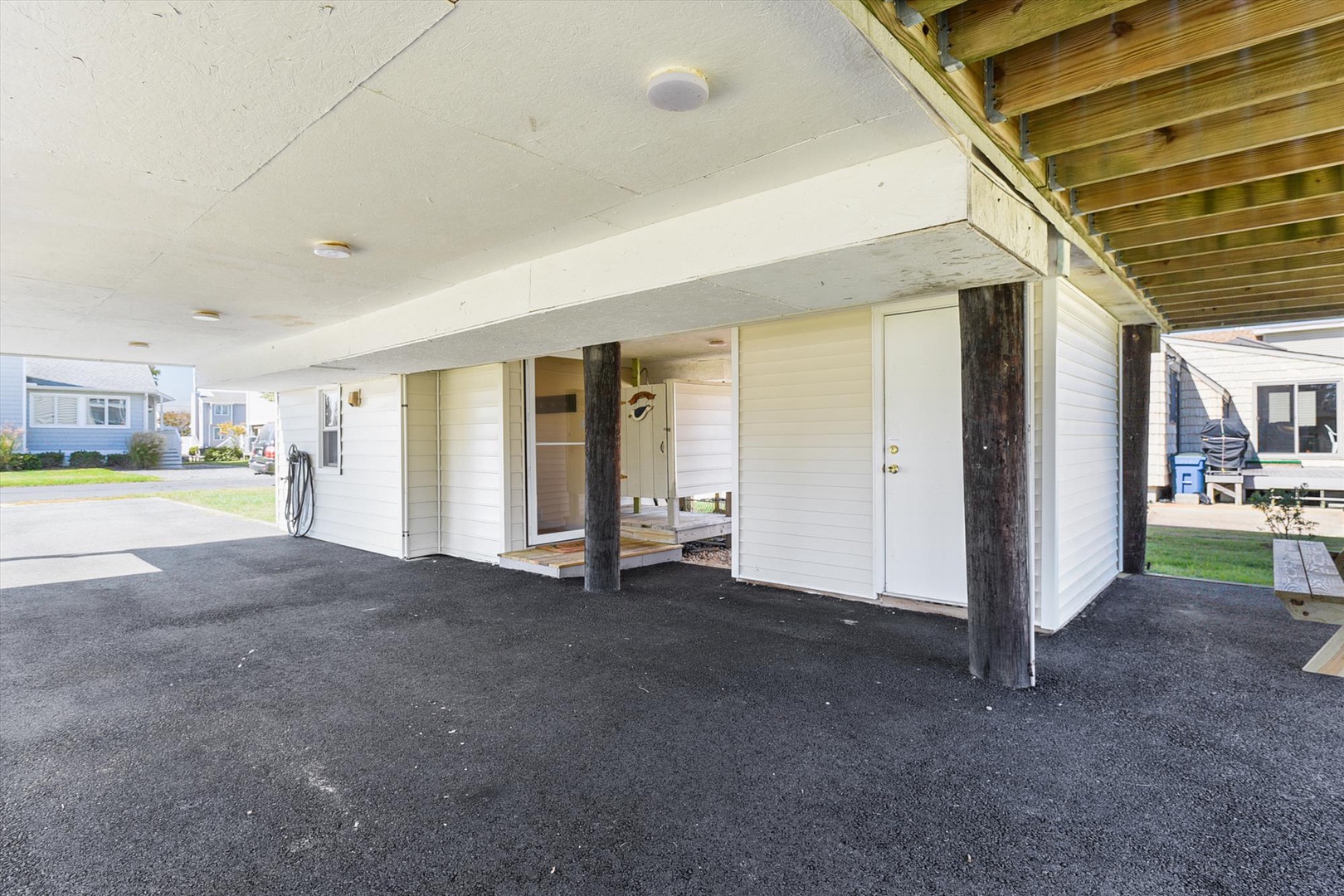 A spacious covered parking area provides convenient, sheltered access to the property's entrance, ensuring easy arrivals and departures regardless of weather conditions.