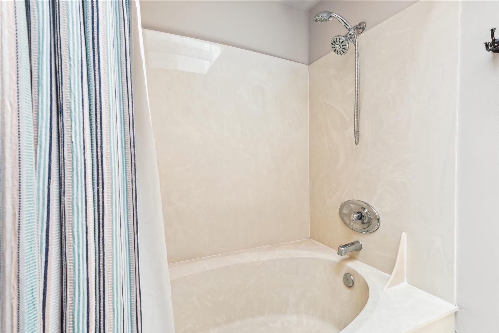 Your private bathroom features a spotless tub-shower combo with modern fixtures, perfect for unwinding after exploring.