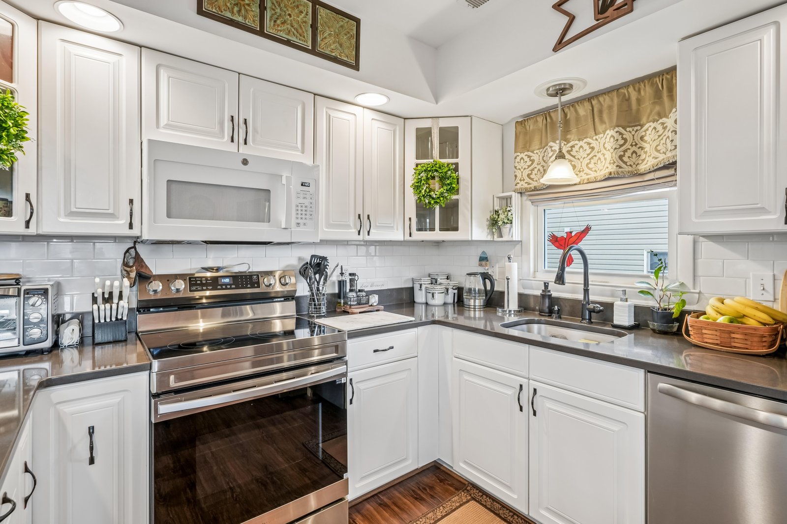 Cook your favorite meals in this bright, fully equipped kitchen with stainless steel appliances, ample counter space, and everything you need for a comfortable stay.