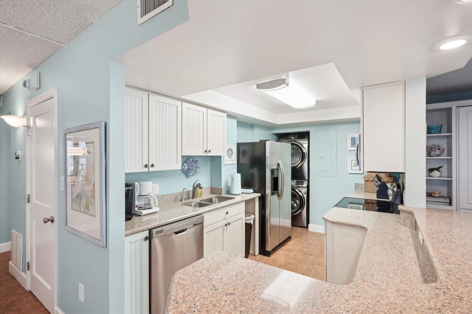 Your fully equipped kitchen features granite countertops, stainless steel appliances, and convenient in-unit washer and dryer for ultimate comfort.