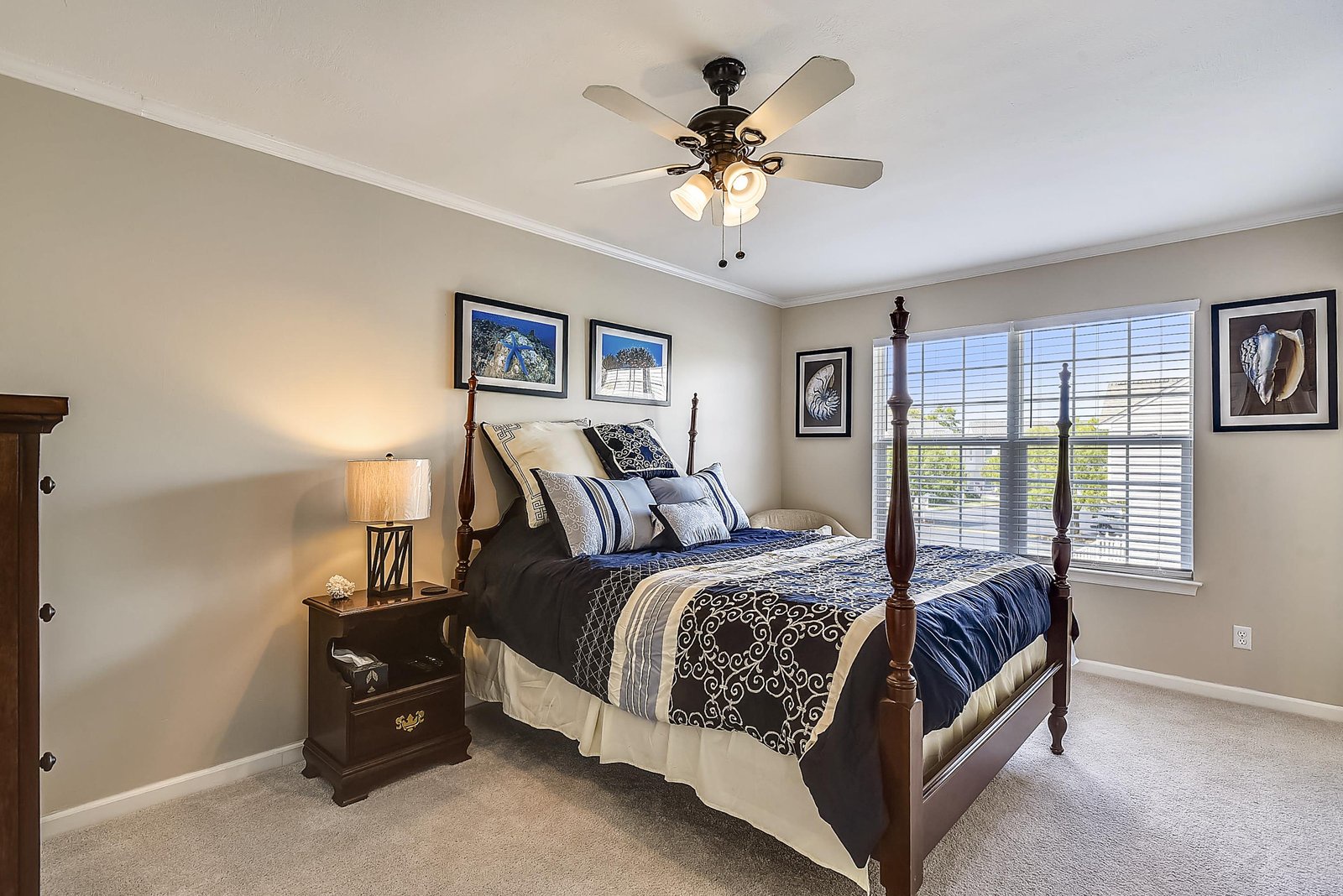 Unwind in your peaceful bedroom, where elegant four-poster charm meets soft natural light. The ceiling fan keeps you comfortable while you rest on plush bedding after a day of adventure.