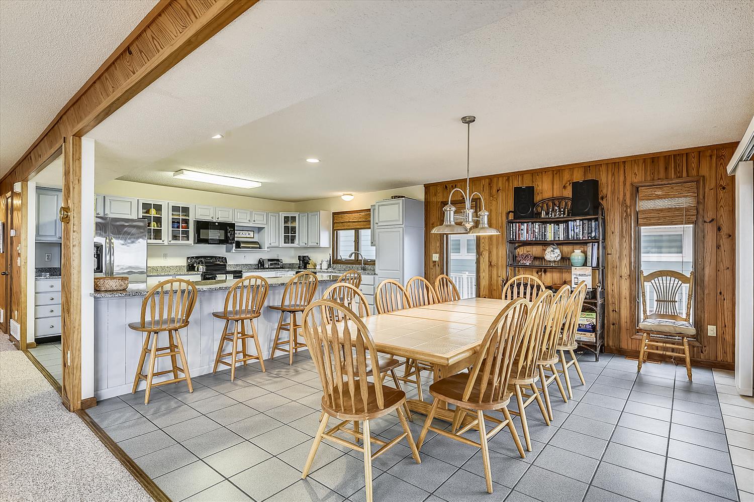 Gather around the spacious dining table or chat at the breakfast bar in this bright, open kitchen and dining area—perfect for family meals and making memories together.