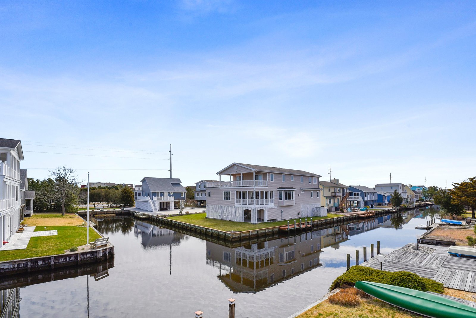 This property sits on a peaceful canal with private docks, where calm waters reflect open skies and coastal charm surrounds you.