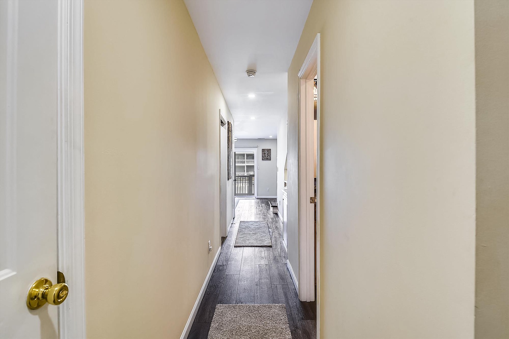 A bright, welcoming hallway guides you through the home, with gleaming floors and fresh finishes that lead to the cozy living spaces waiting just beyond.