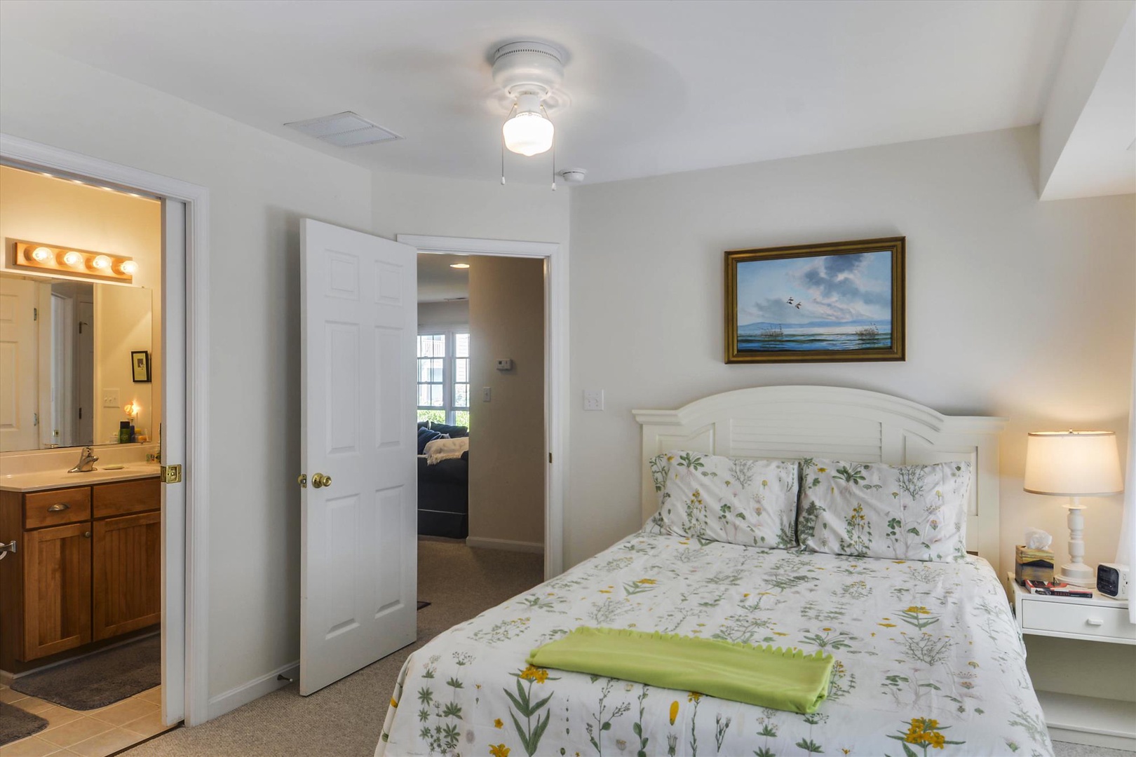 Soft linens and coastal charm create your peaceful retreat, with a private en-suite bath just steps away for your convenience.
