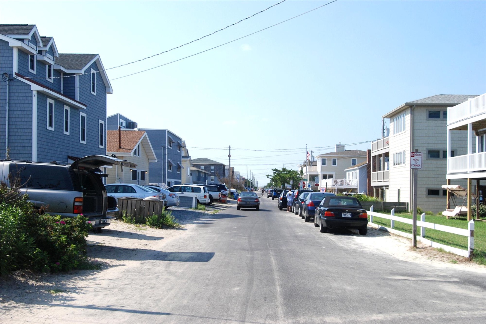 Quiet residential neighborhood with nearby beach access, featuring well-maintained homes and convenient street parking for guests during their coastal getaway.