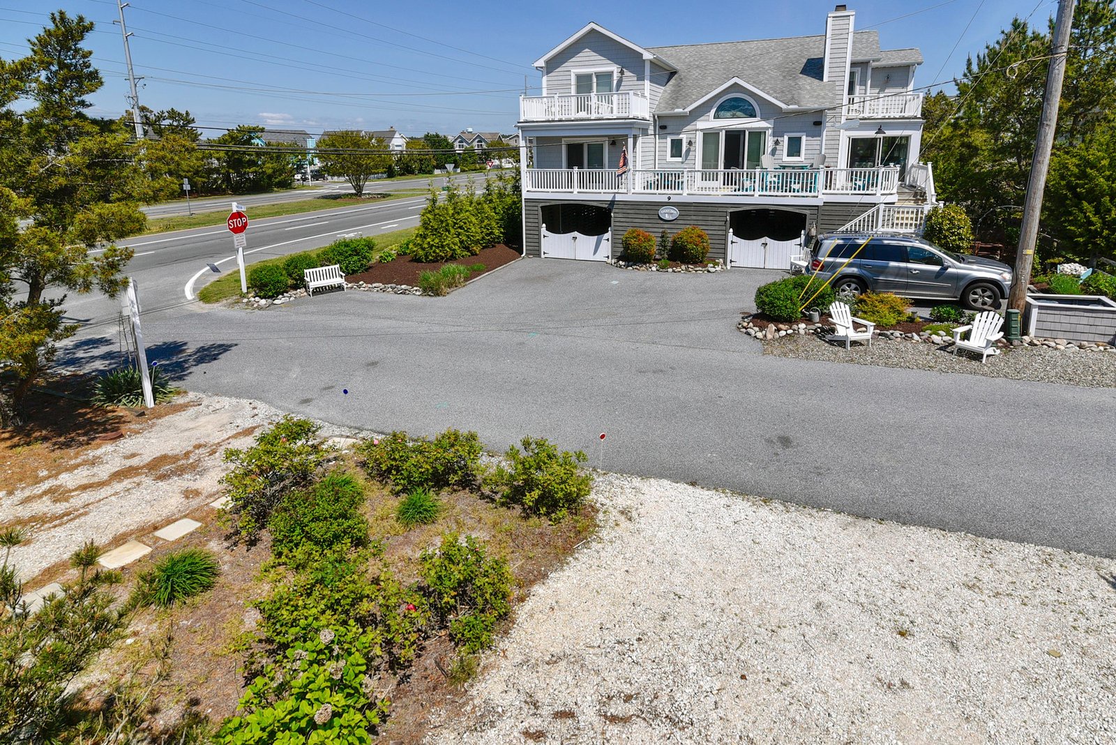 An elevated coastal home featuring spacious balconies and convenient parking, set in a peaceful residential area near the beach.